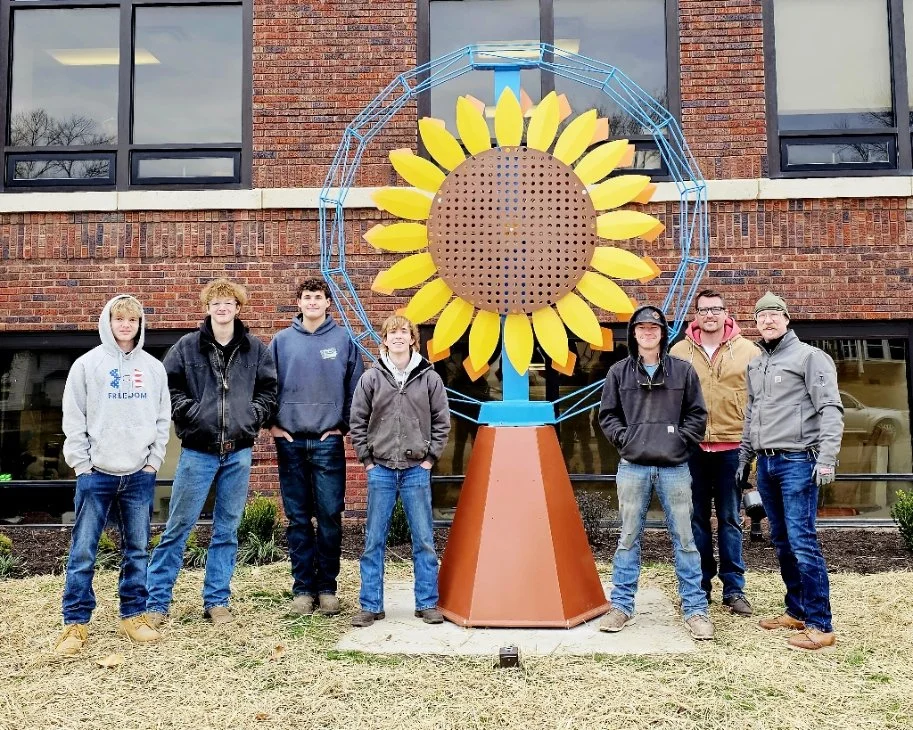 Sunflower kinetic sculpture photo featuring the high school artists