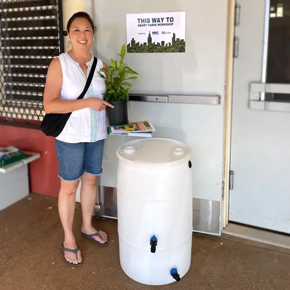 Raffle winner of a free 50-gallon rain barrel at the Smart Yards 2024 Workshop hosted by Mālama Maunalua and 3Rwater