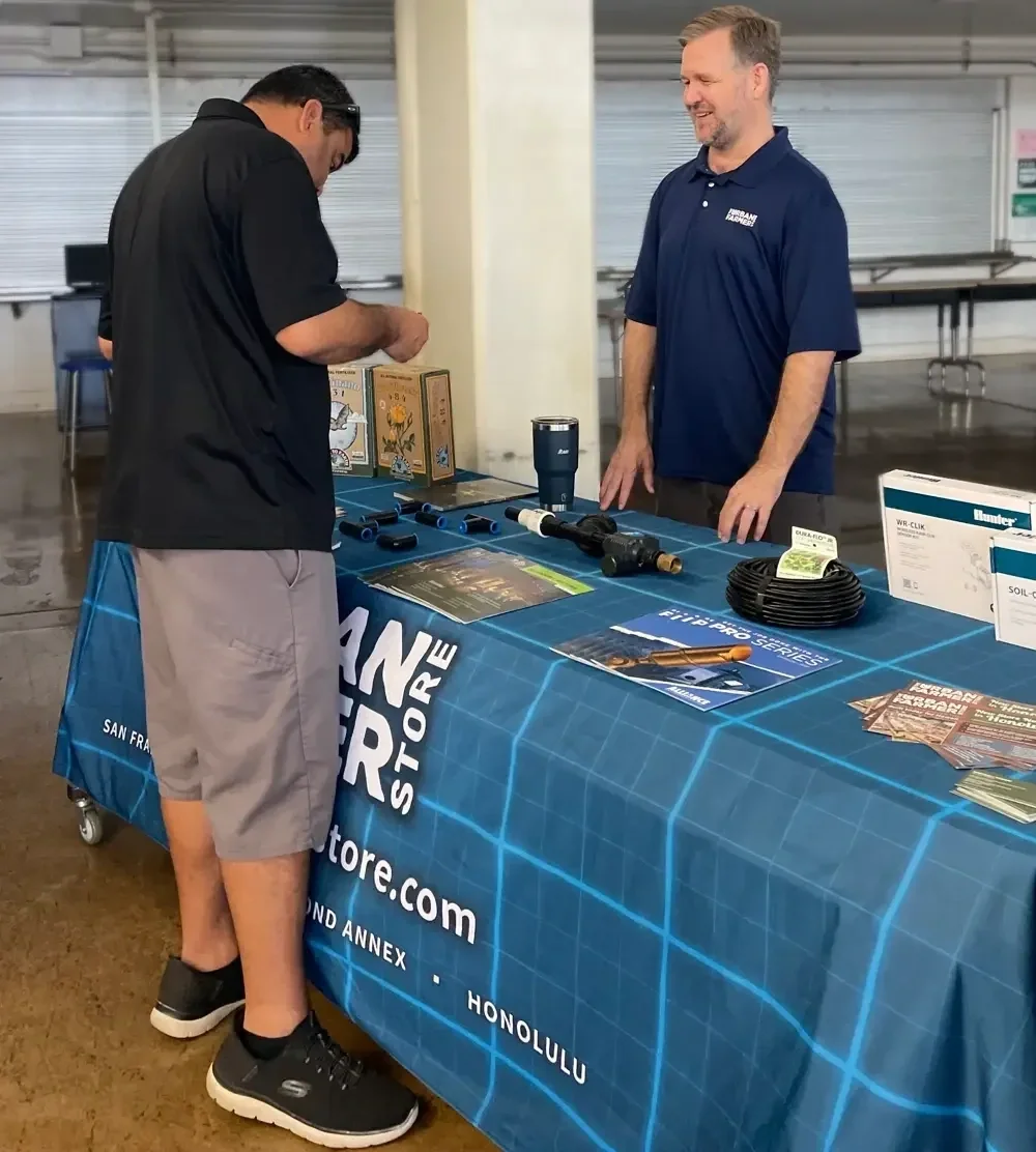 A community member learns about urban farming from Heritage Landscape Supply (formerly Urban Farmer Store) at the Smart Yards 2024 Workshop hosted by Mālama Maunalua and 3Rwater