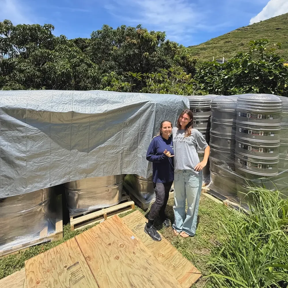 Mālama Maunalua crew with new rain barrels ready to be installed in the community, part of the Rainwater Capture Incentive Program led by Mālama Maunalua and the City and County of Honolulu Department of Facility Maintenance