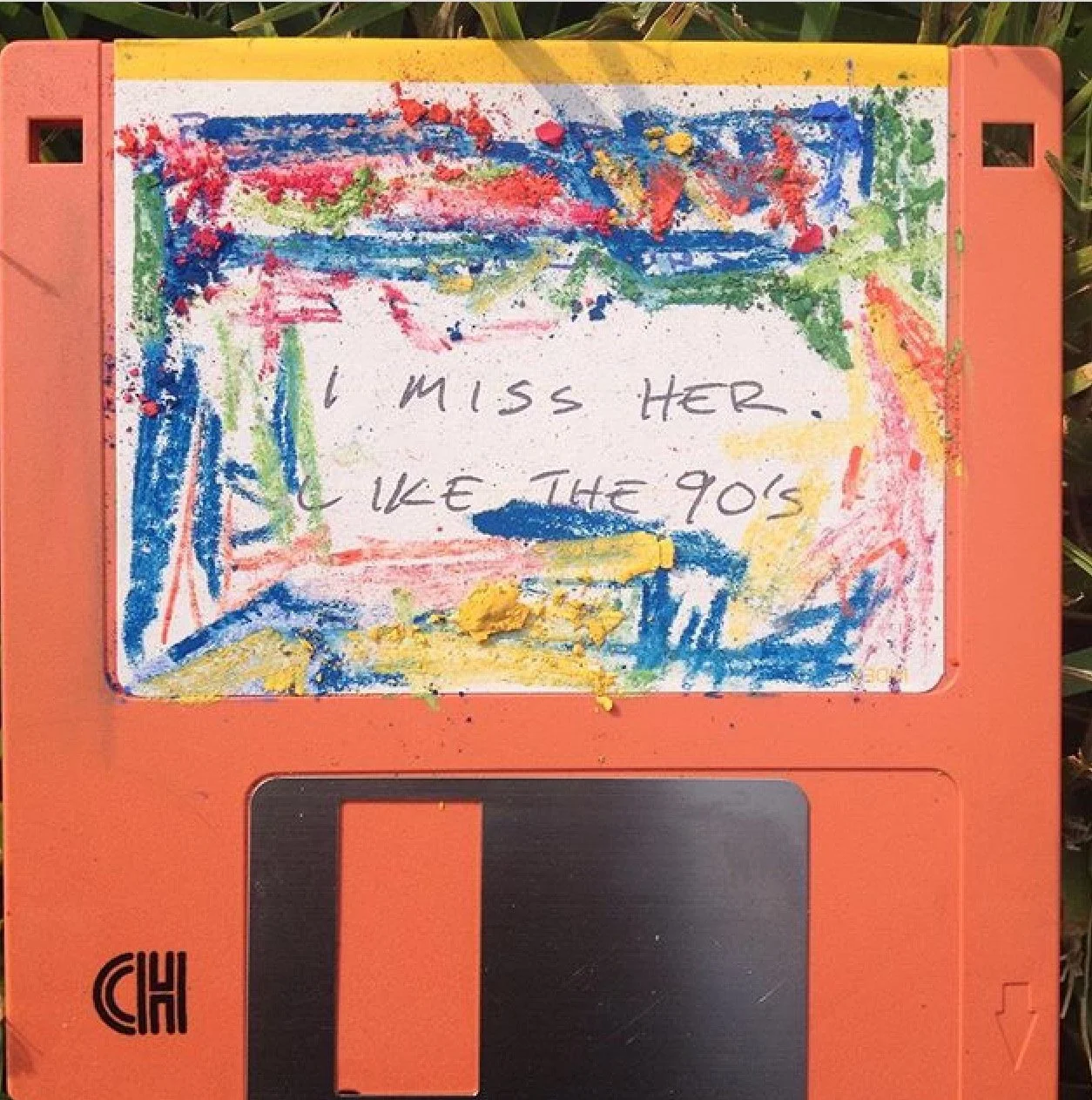 Colorful Abstract Painting on Orange 90's Floppy Disk with Written Text I Miss Her Like The 90's by Kelvin Spears Contemporary Artist Little Spears Studios Art Photography and Text Study @Soxerboxer91