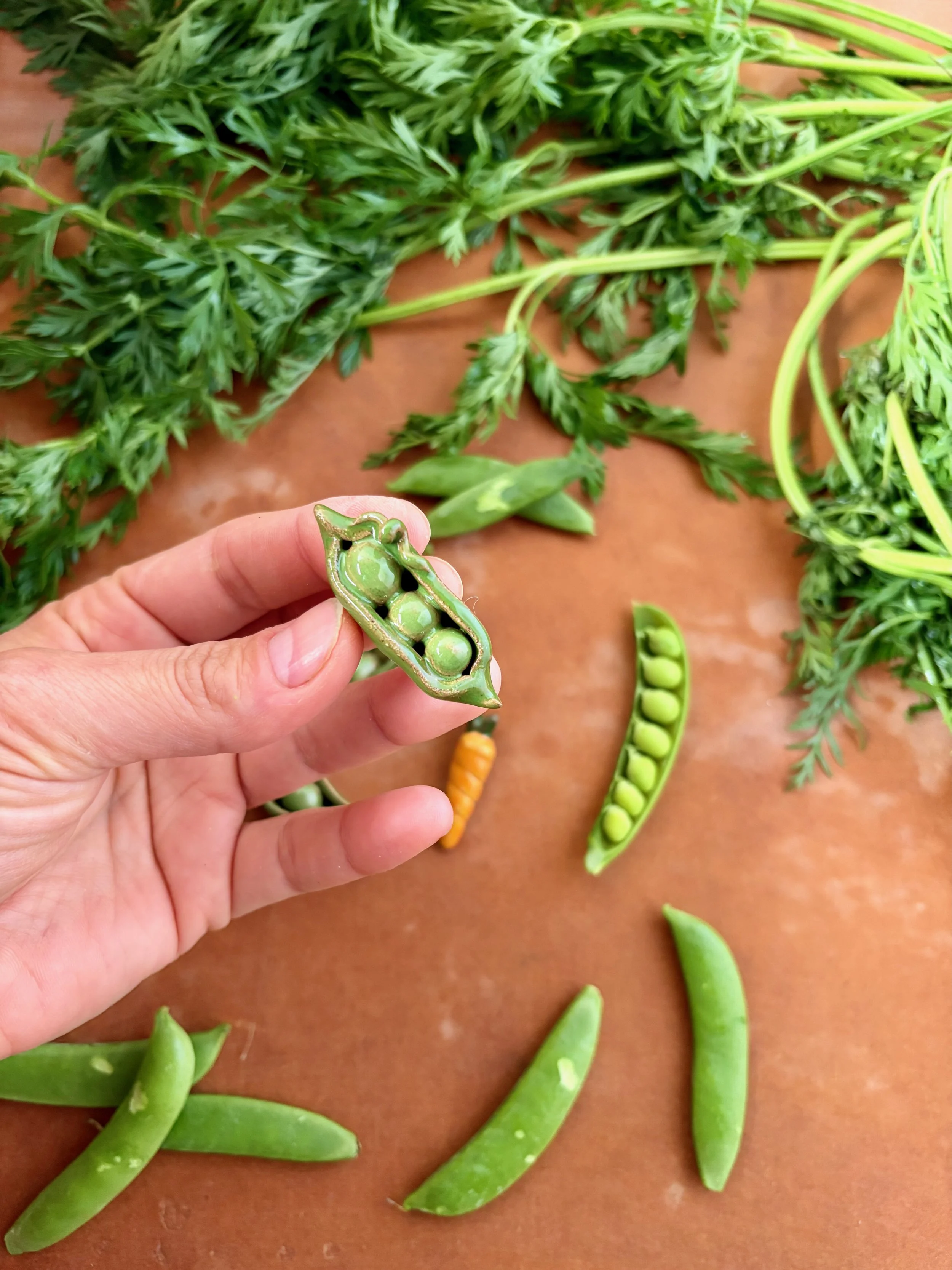 pea_pod_magnet_held.jpeg