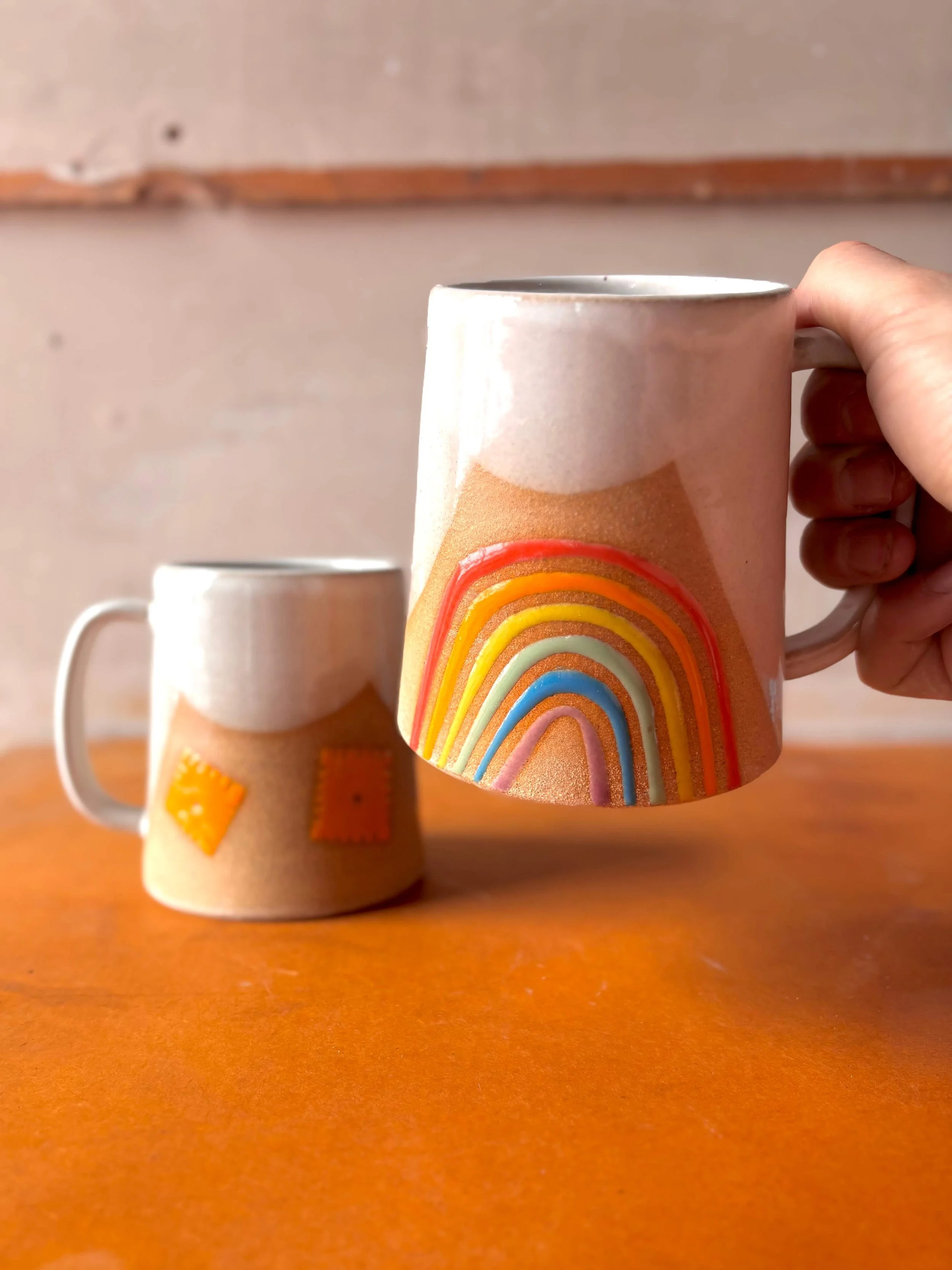 rainbow_mug_in_hand.jpg