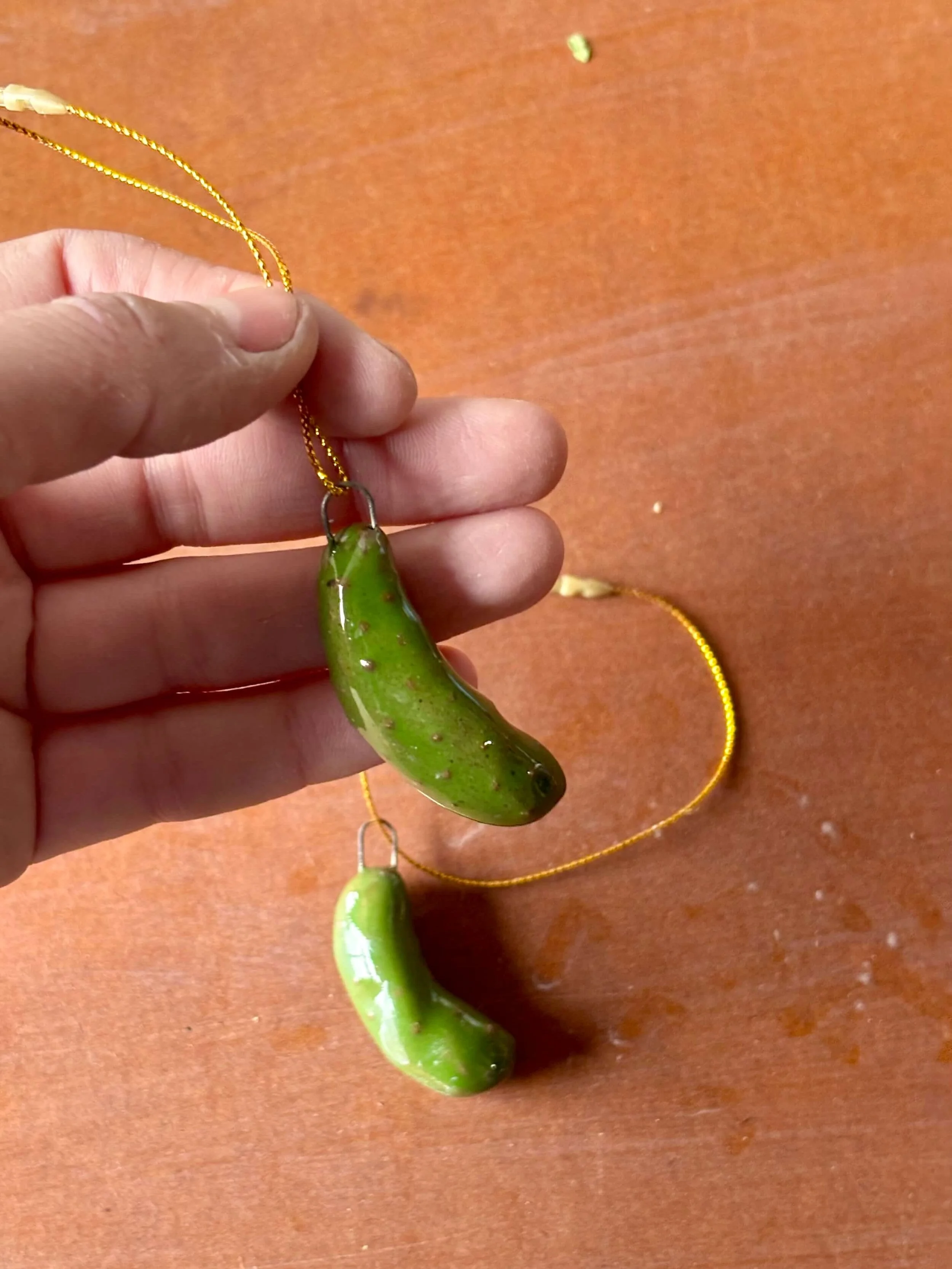 pickle_ornament_hand_duo.jpg