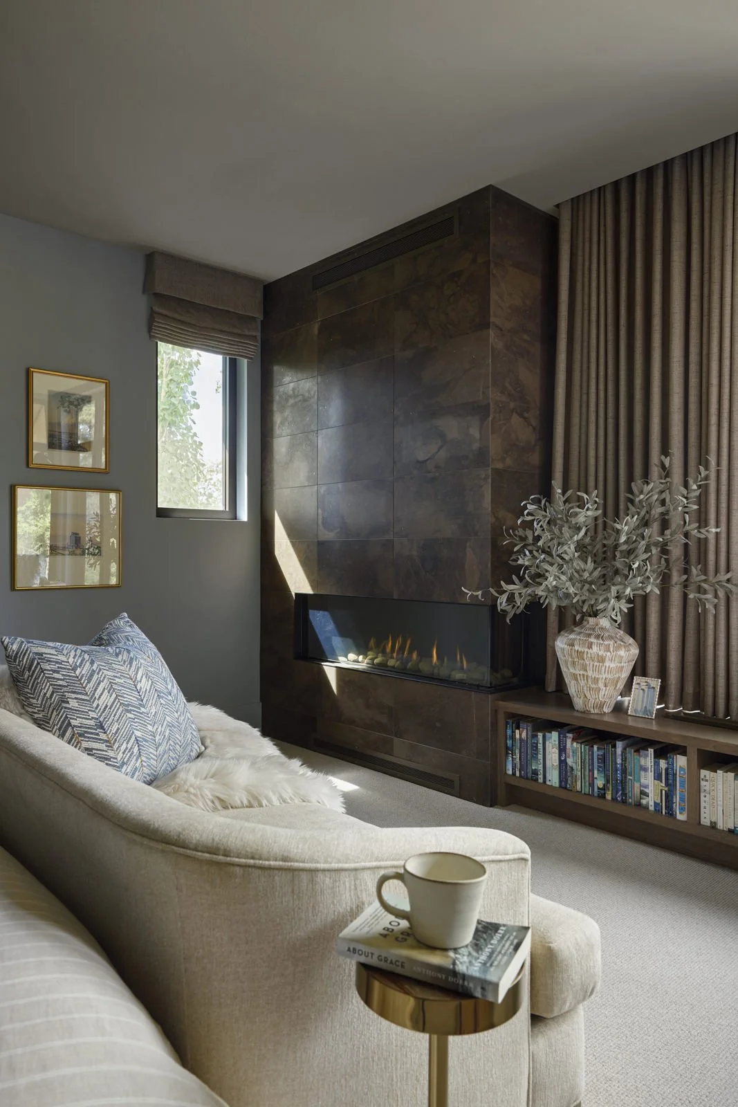 second primary suite with fireplace, bench and window