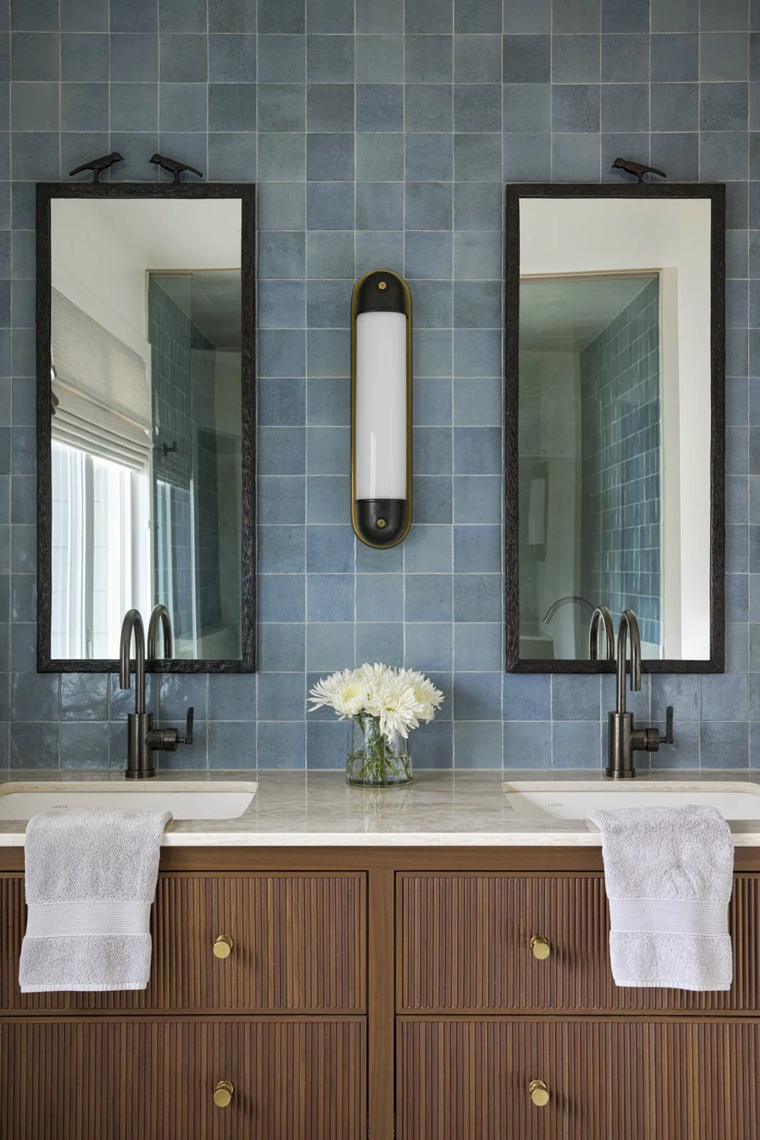 third primary ensuite with vanity and square blue tile