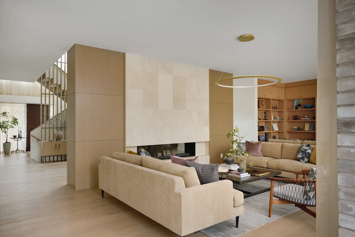 third modern living space with thoughtful design touches, fire place couch and open concept