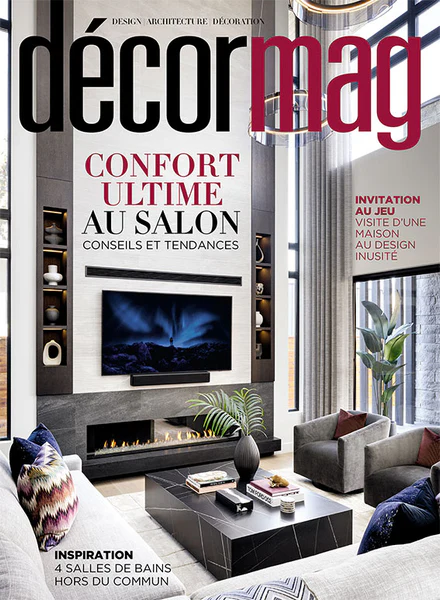 Cover of Decor Mag magazine featuring a modern living room with a fireplace, a wall-mounted television, surrounded by built-in shelves, and a large window with curtains, highlighting interior design and decoration.