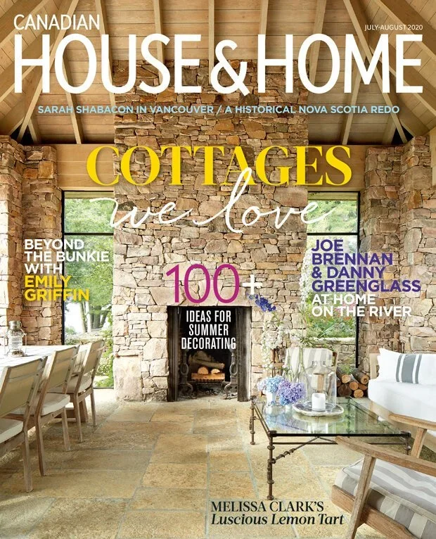 Cover of Canadian House & Home magazine, July-August 2020 issue, featuring a cozy interior with stone walls, large windows, a fireplace, and relaxed furniture, focusing on cottages and summer decorating ideas.