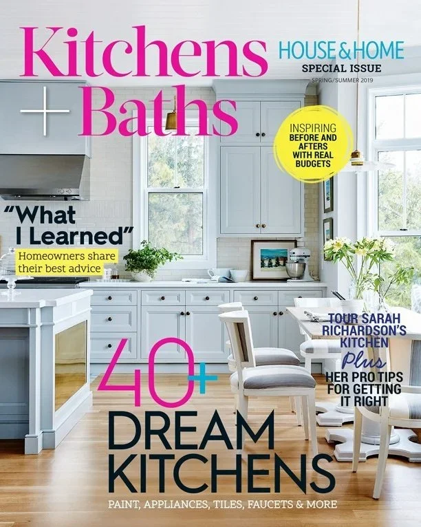 Cover of a magazine titled 'Kitchens & Baths' featuring a bright, white kitchen with cabinetry, a window, and a dining area with white chairs, highlighting design ideas for dream kitchens.