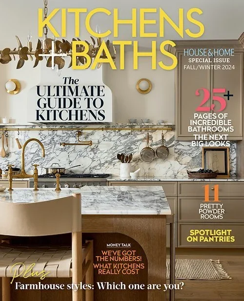 Cover of a magazine titled 'Kitchens & Baths' showing a modern kitchen with white marble countertops, a gold faucet, and hanging pot racks with pots and utensils. The cover has various headlines about kitchen and bathroom design and features, including 'The Ultimate Guide to Kitchens', '25+ Pages of Incredible Bathrooms', and 'Spotlight on Pantries'.