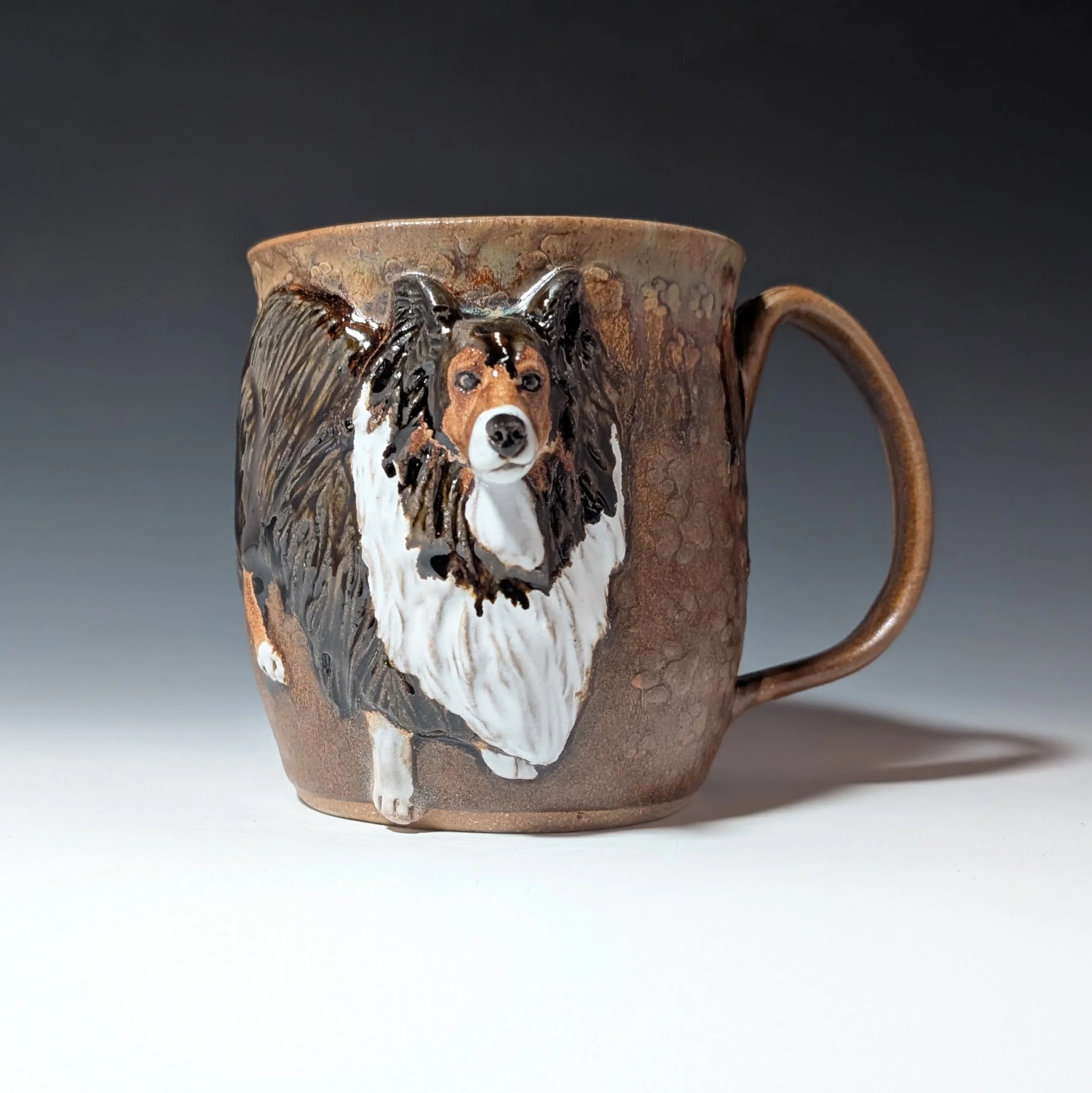 Original collie dog relief on a handmade ceramic mug.