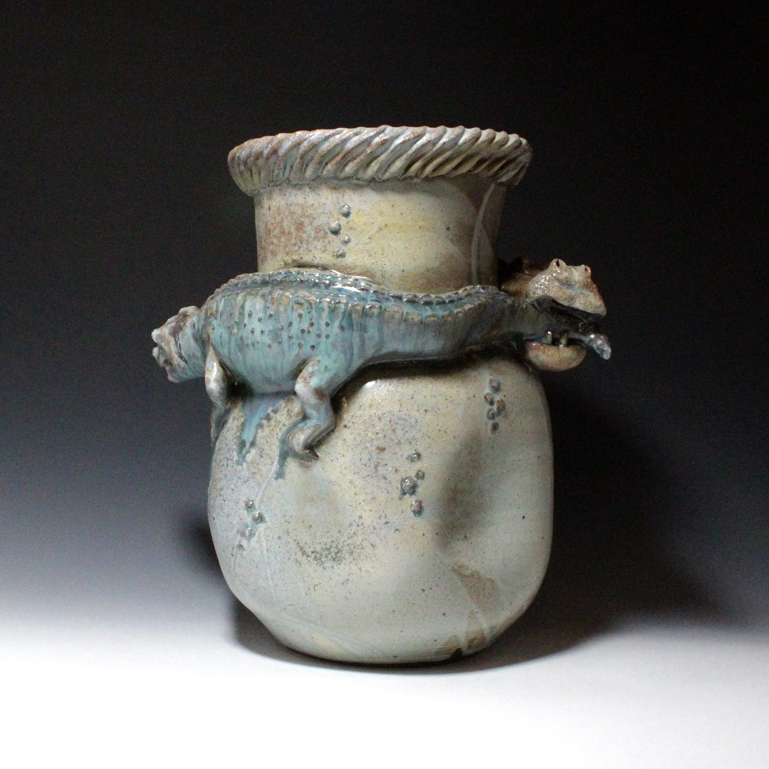 Notice the imperfect dents in the bottom bulge of the blue vase and how it adds to the feeling of fight and imbalance as two foes try to chase each other off. 