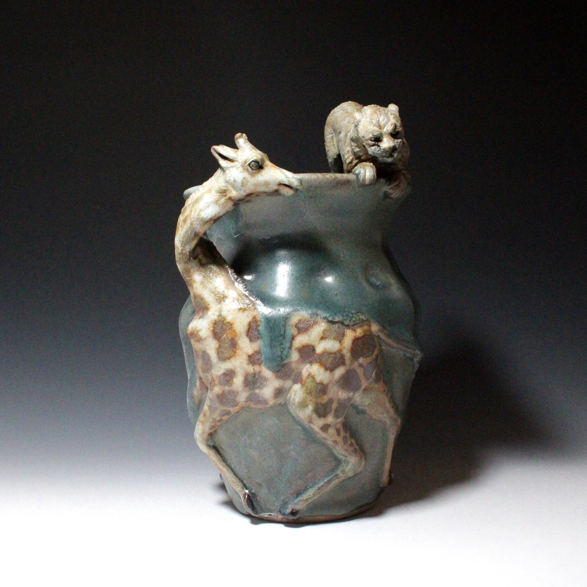 A terrified giraffe runs from an attacking cheetah, but cannot help but risk a terrified look back on the side of this green vase. 