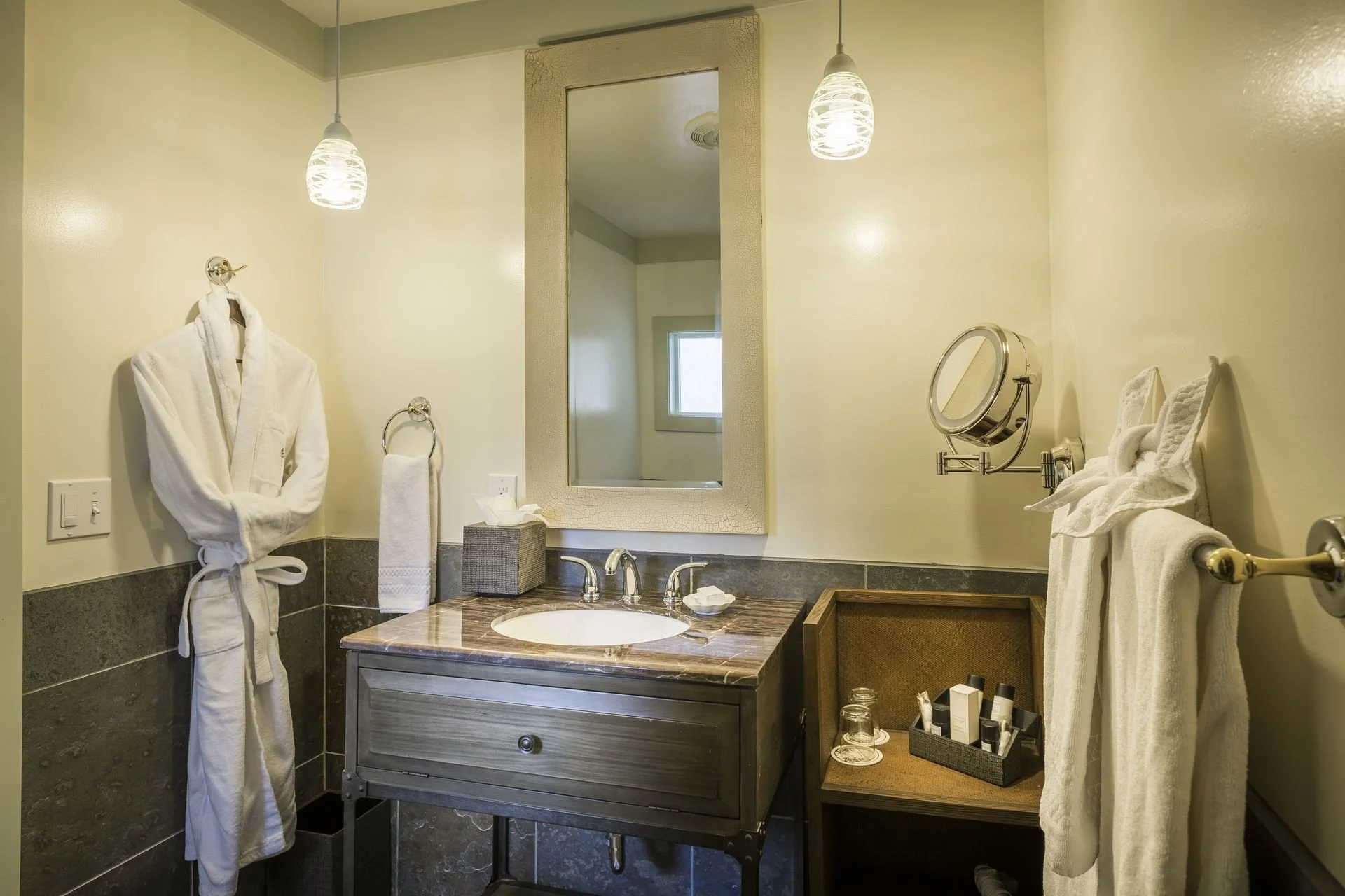 Powder room with robes in Classic Vintage Queen at Heritage House Resort