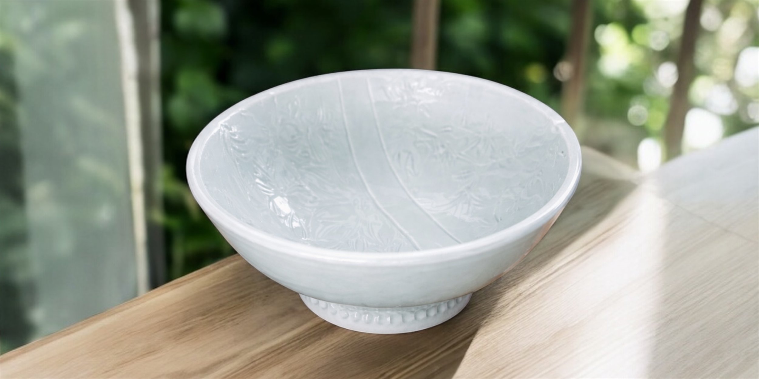 Handmade bloom-tectured ceramic bowl.