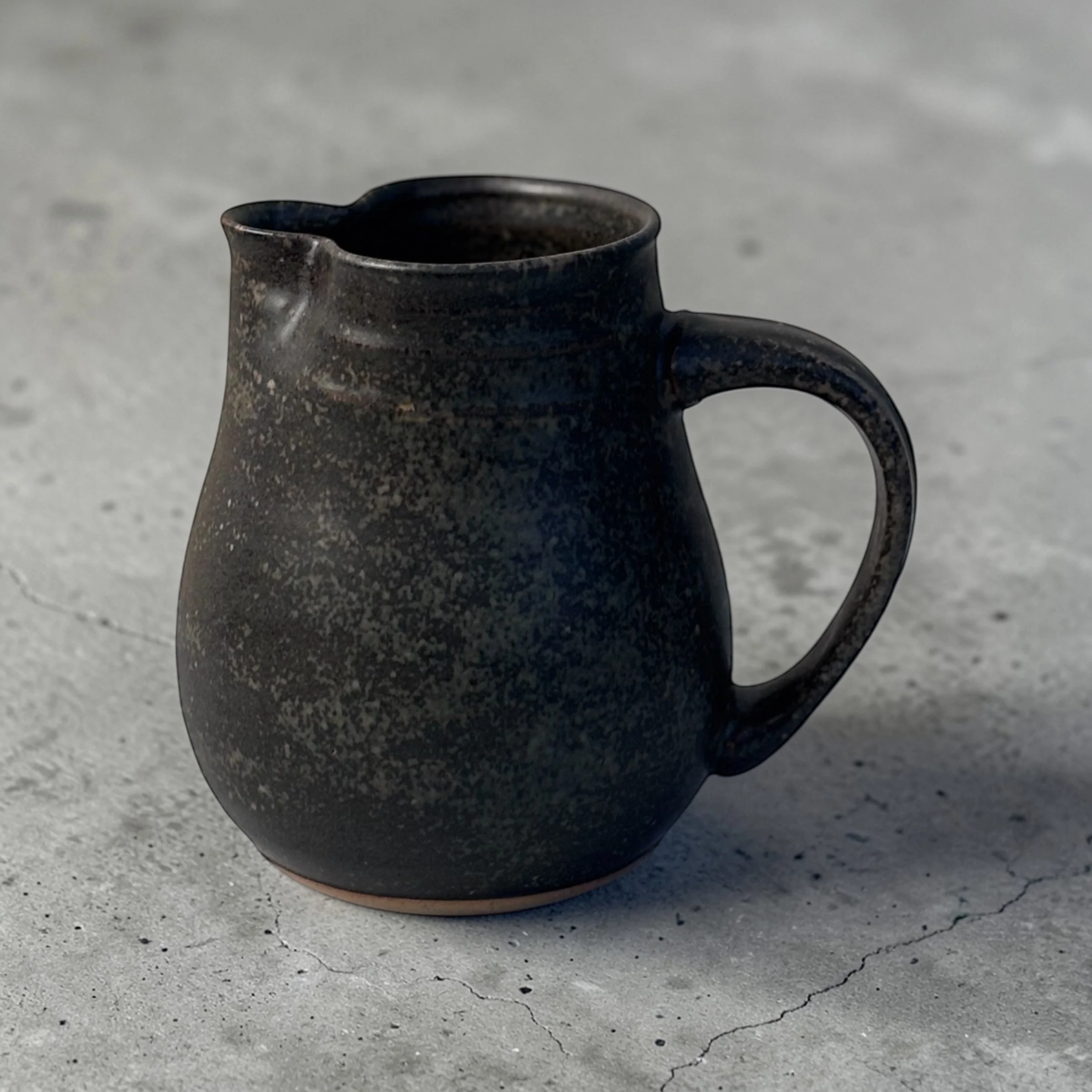 Handmade ceramic jug with handle and spout, wheel-thrown Australian pottery with natural throw rings