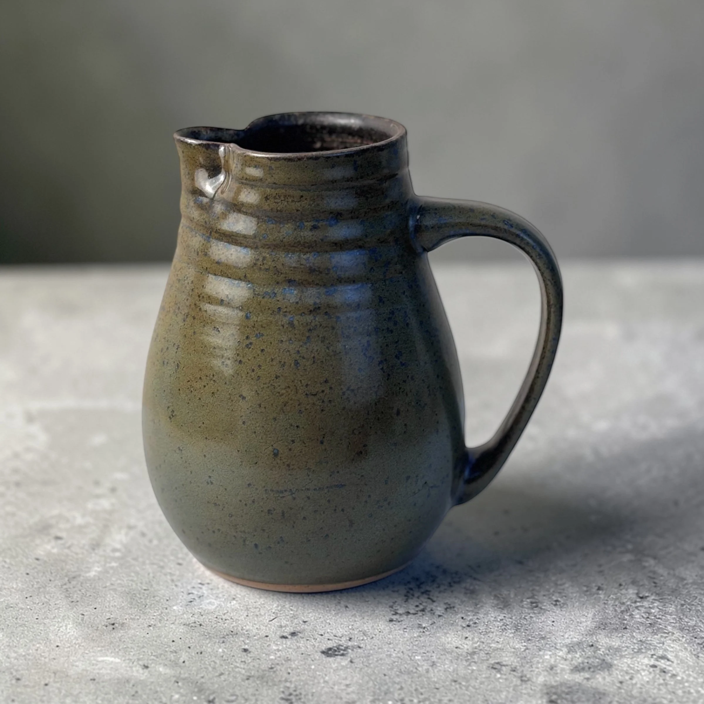 Handmade ceramic jug with handle and spout, wheel-thrown Australian pottery with natural throw rings