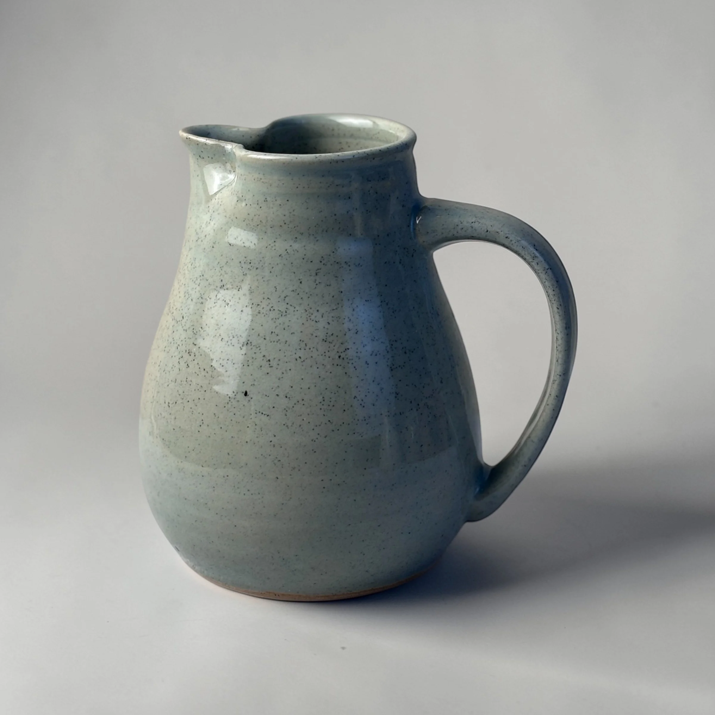 Handmade ceramic jug with handle and spout, wheel-thrown Australian pottery with natural throw rings