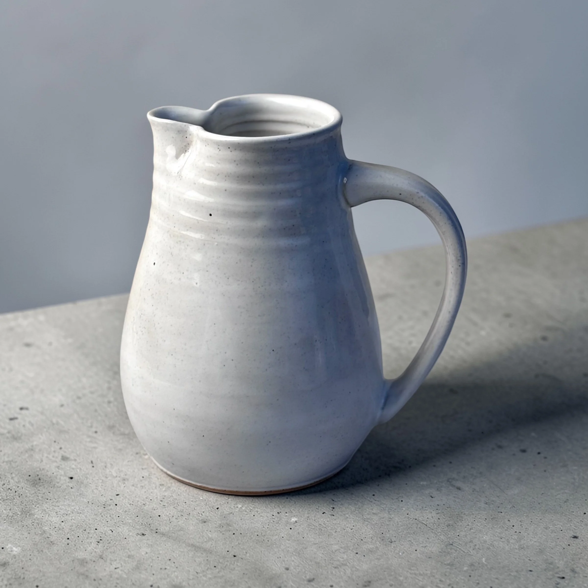 Handmade ceramic jug with handle and spout, wheel-thrown Australian pottery with natural throw rings