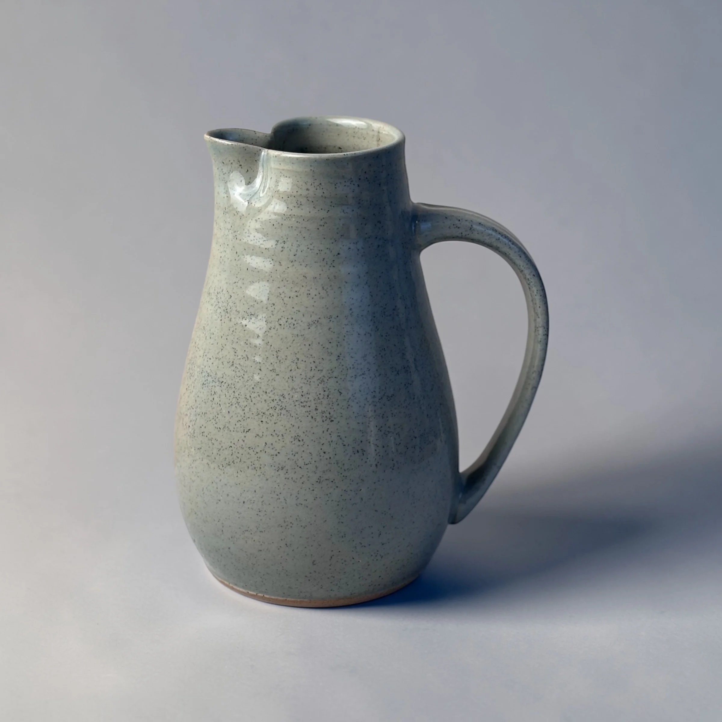 Handmade ceramic jug with handle and spout, wheel-thrown Australian pottery with natural throw rings
