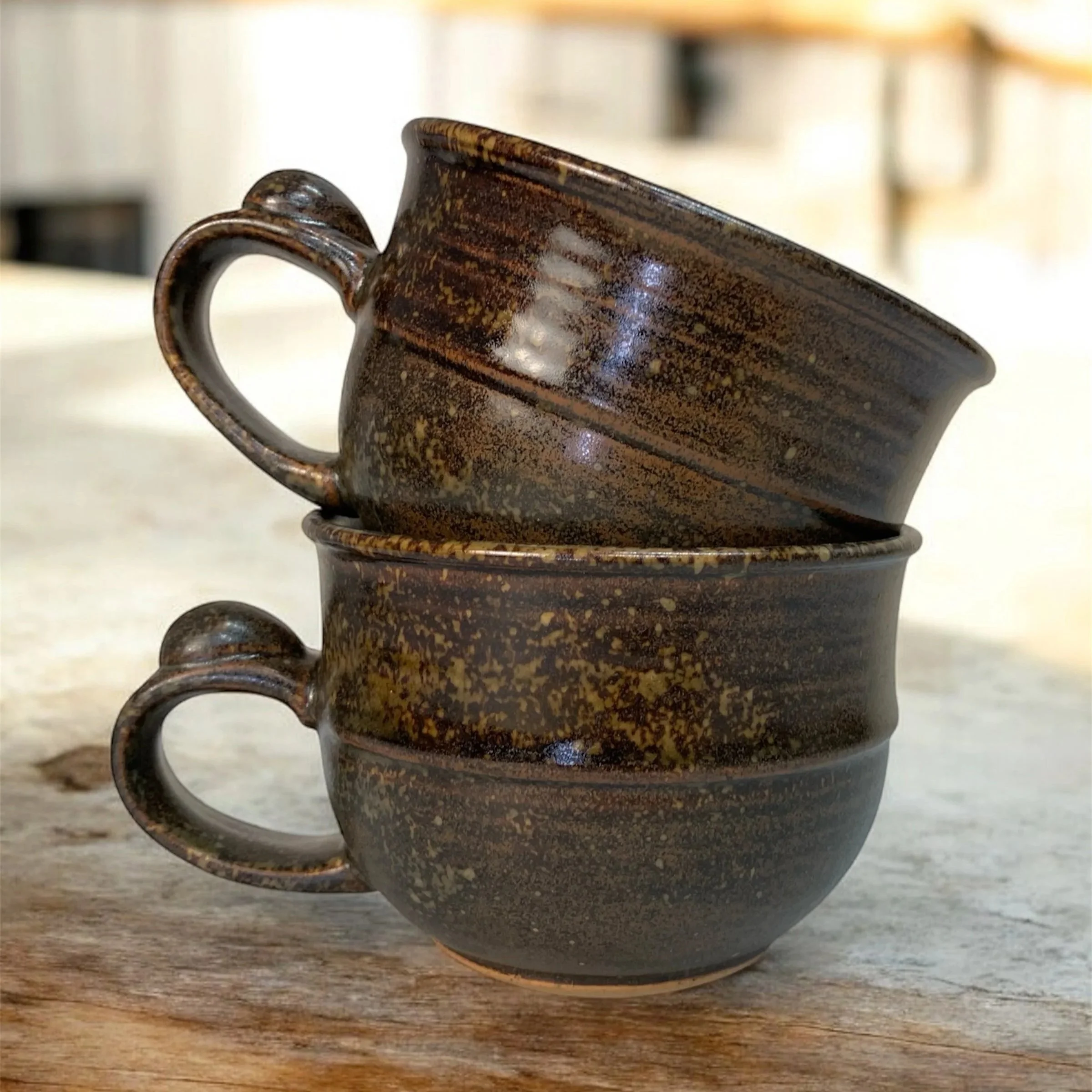 Handmade wide ceramic tea cup with fitted lid and thumb rest, wheel-thrown functional pottery made in Australia