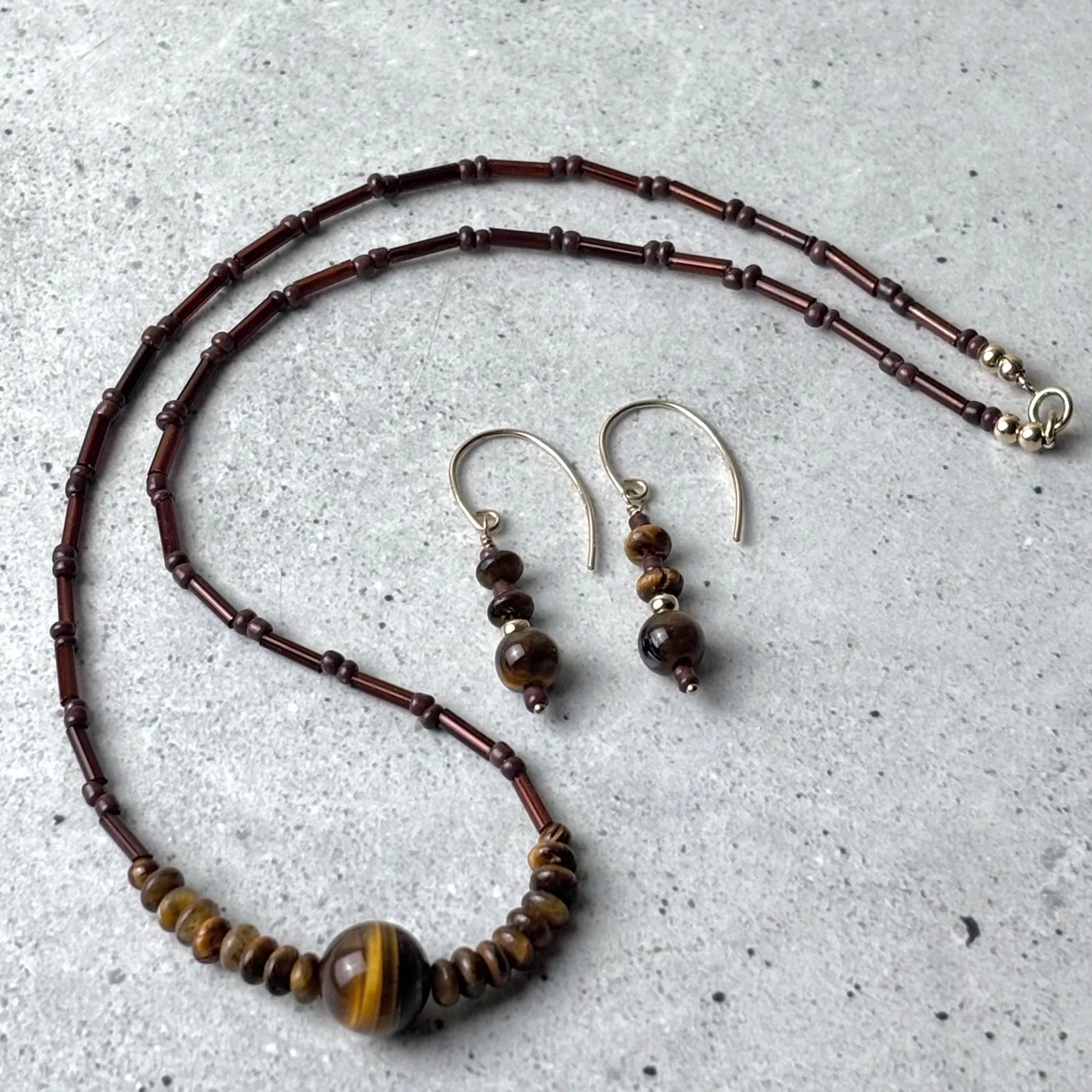 tiger eye anchored necklace and earrings with bead details