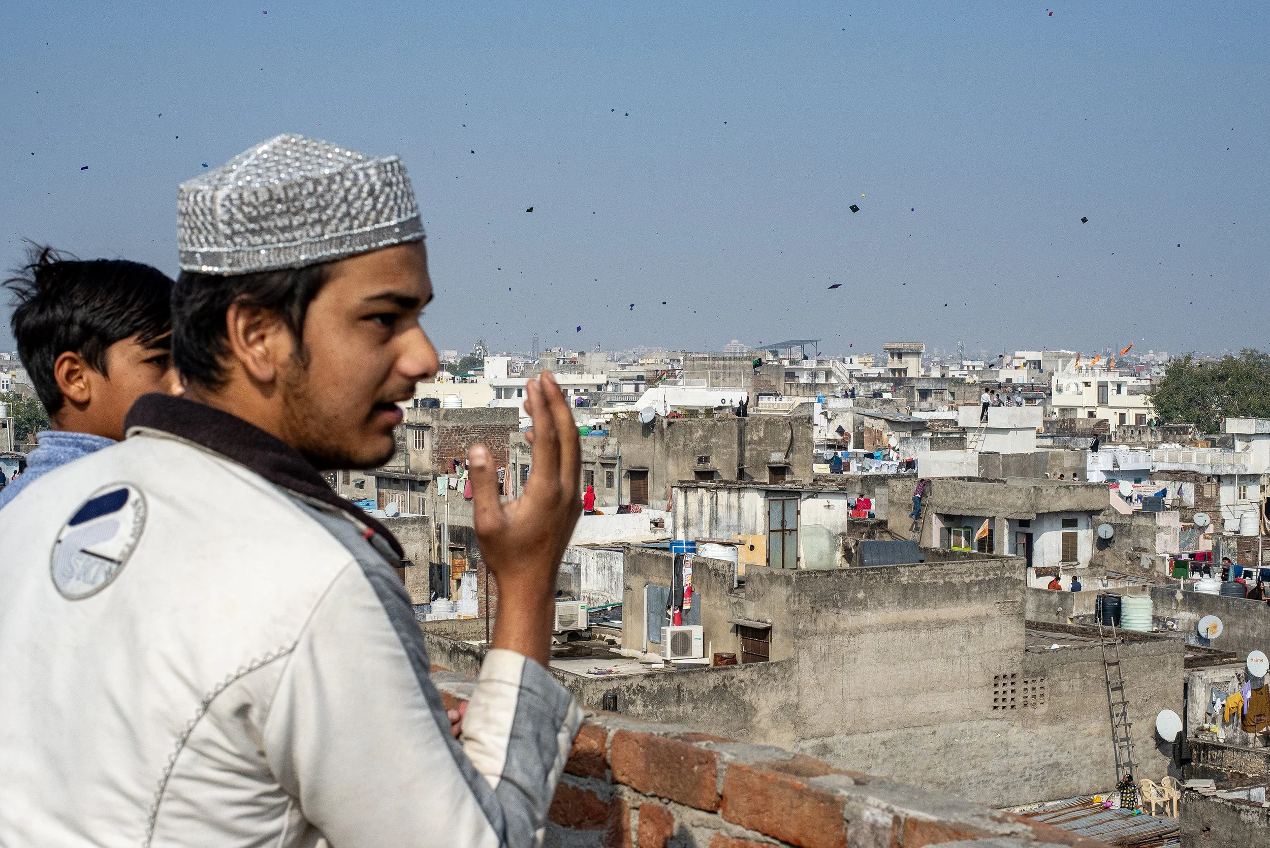 People kiting on the roofs during the kite festival. Jaipur, Rajastan