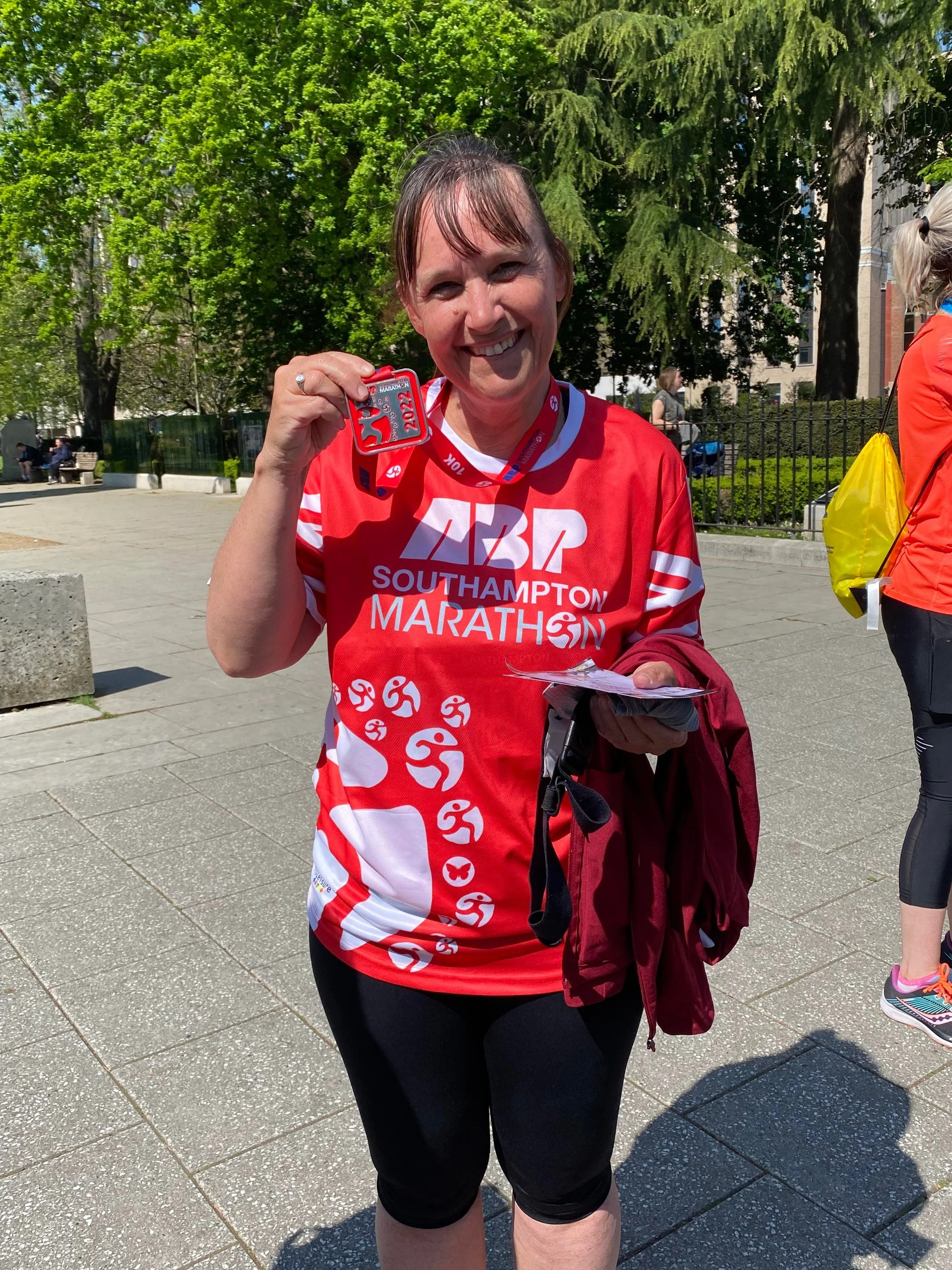 Marathon participant holding medal