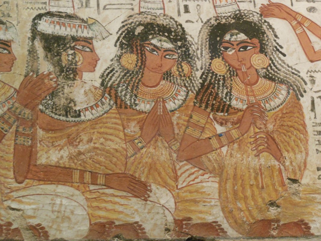 Ancient Eqyptian women wearing earrings and decorative collars.jpg