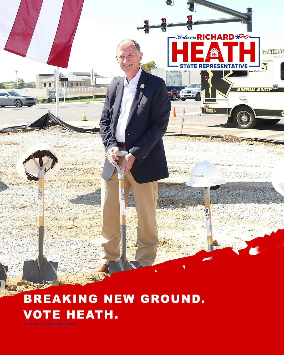 Richard Heath, a state representative candidate, standing at a groundbreaking event holding a shovel, with construction helmets and a flag in the background, and a sign supporting his campaign.