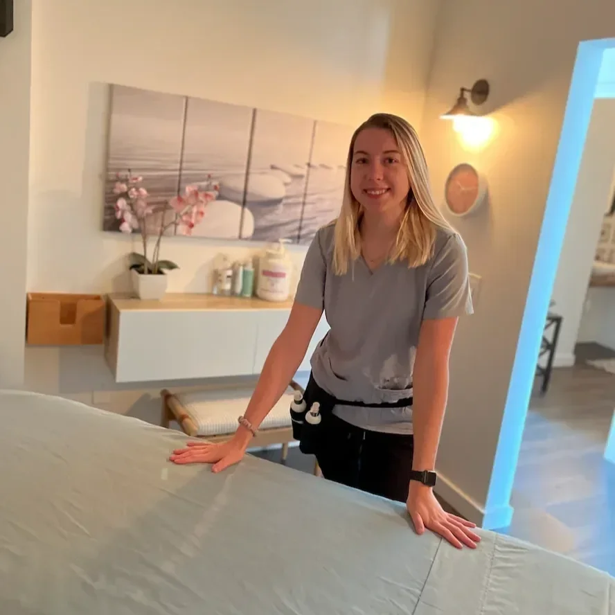 Massage therapist in a treatment room at Fishman Chiropractic and Massage