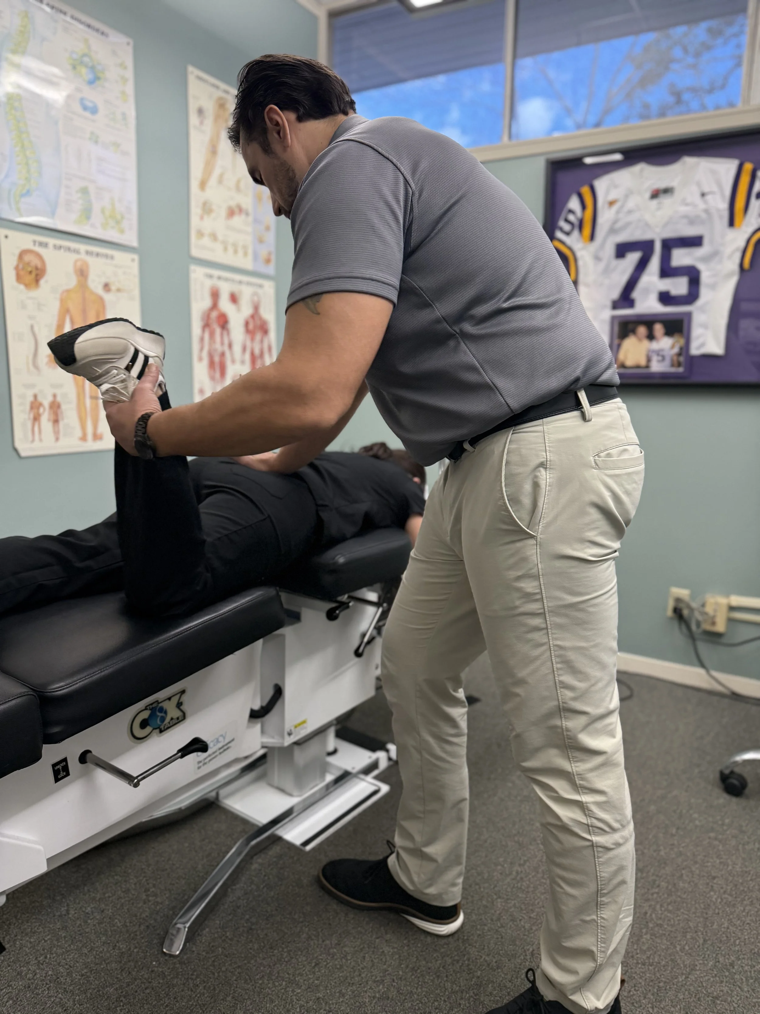 Dr. Cormier Adjusting Patient