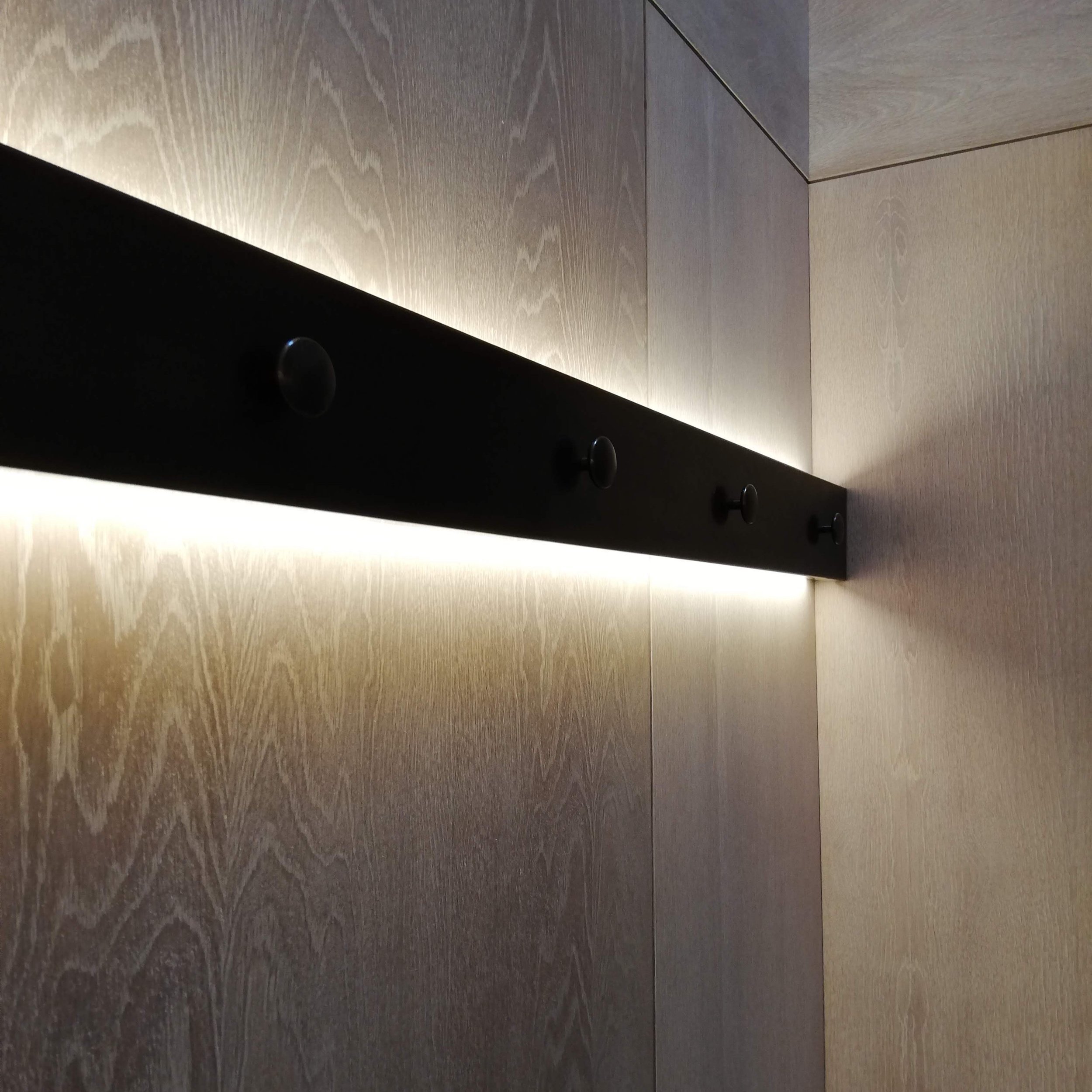 AD Designs hand made bespoke bronze patinated clothes rail with rear lighting