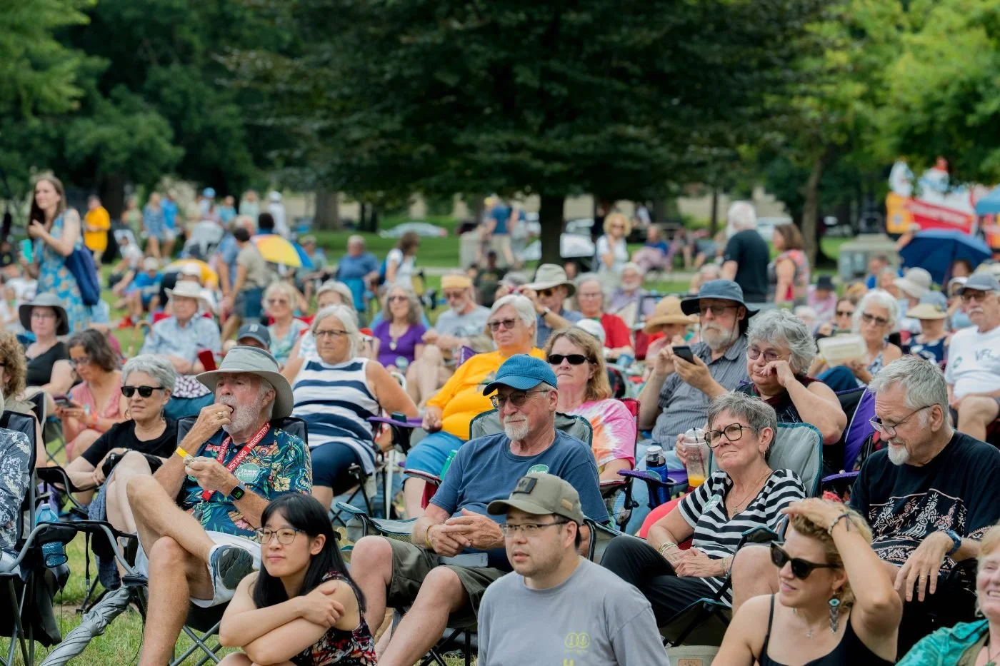 Crowd gathered at outdoor performance stage at Home County Music & Art Festival in Victoria Park, London, Ontario
