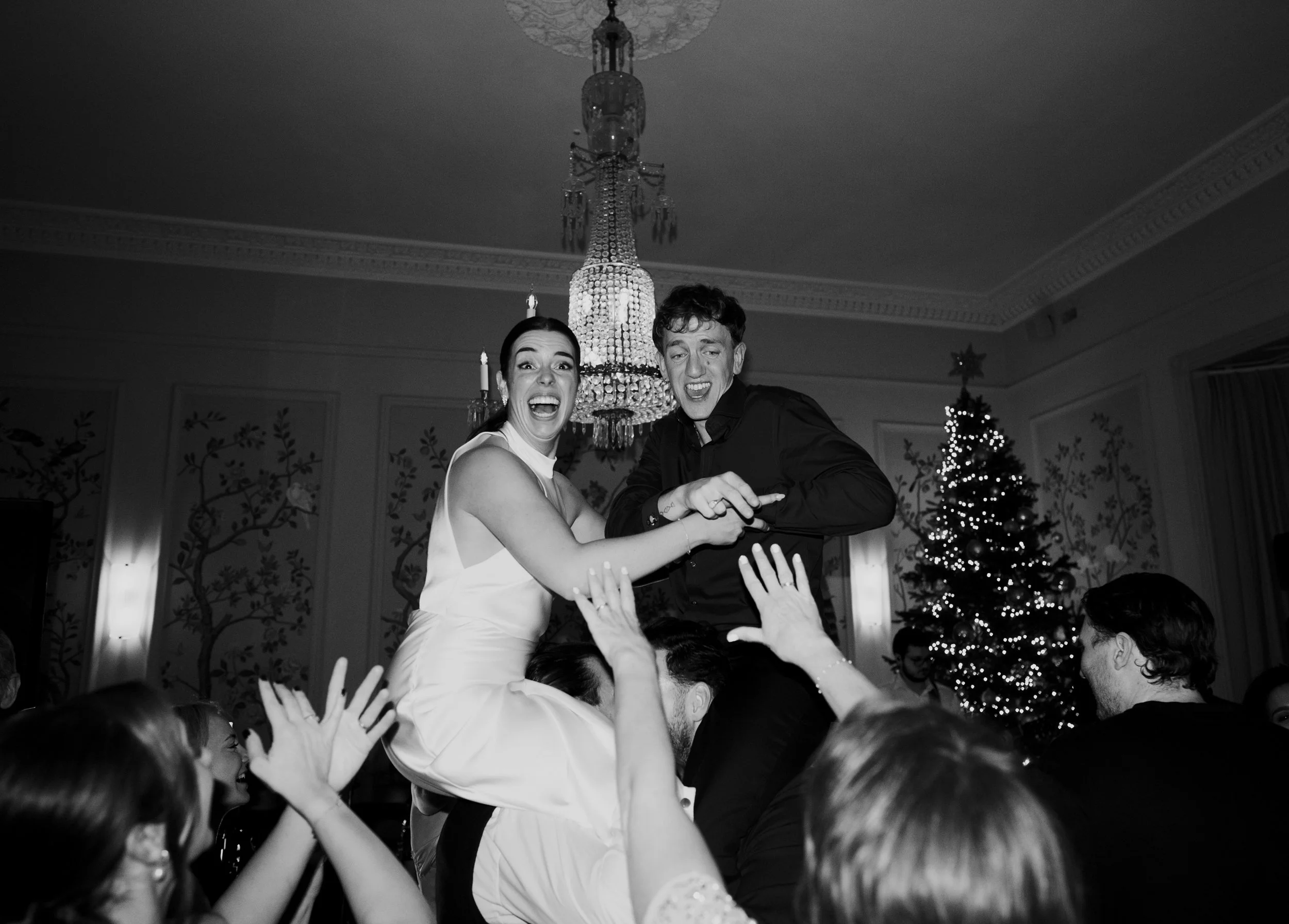 Wedding Dance Floor with couple on peoples shoulders