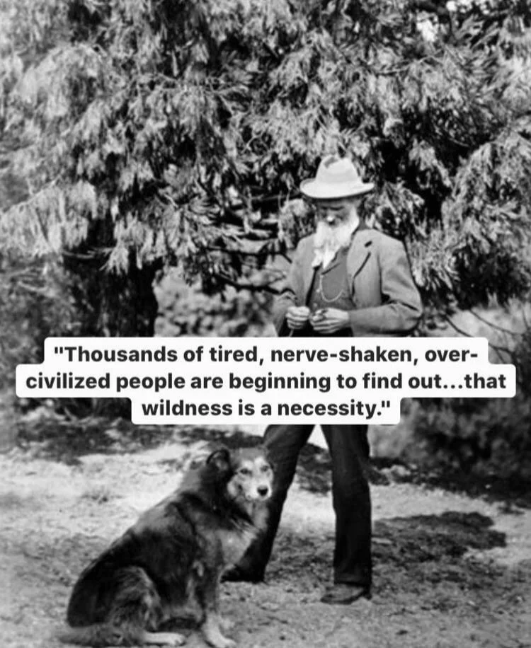 A black and white photo of a man with a beard wearing a hat and coat, standing outdoors in front of trees. A dog is sitting on the ground beside him. There is a quote overlayed in the center that says, 'Thousands of tired, nerve-shaken, over-civilize