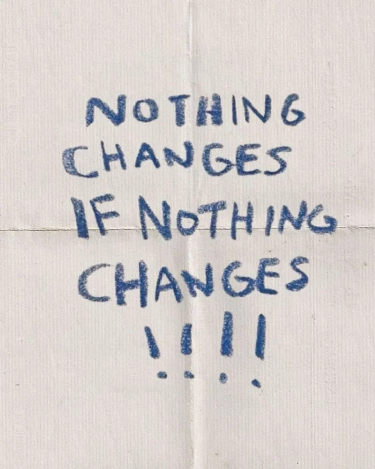 Handwritten note on white paper with blue ink that says, "Nothing changes if nothing changes!!!"