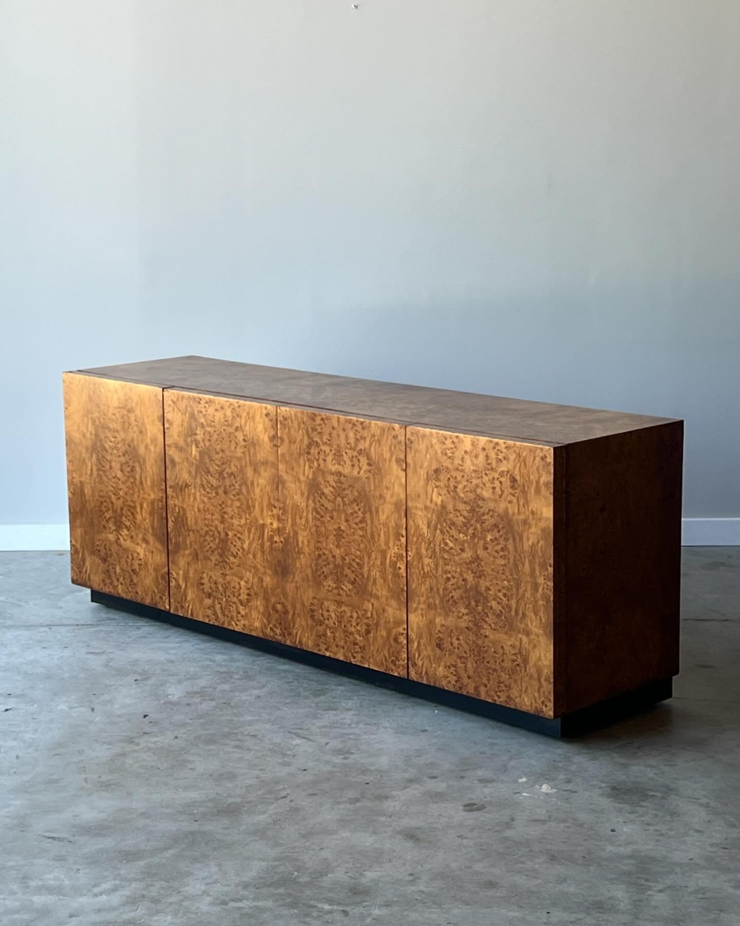 SOLD ~ Mid-century burl wood credenza or sideboard. This stunner was made by Dillingham in the style of Milo Baughman. It&rsquo;s not often we offer burl wood items and if we had a bigger house, this one would be coming home with us. This gorgeous pi
