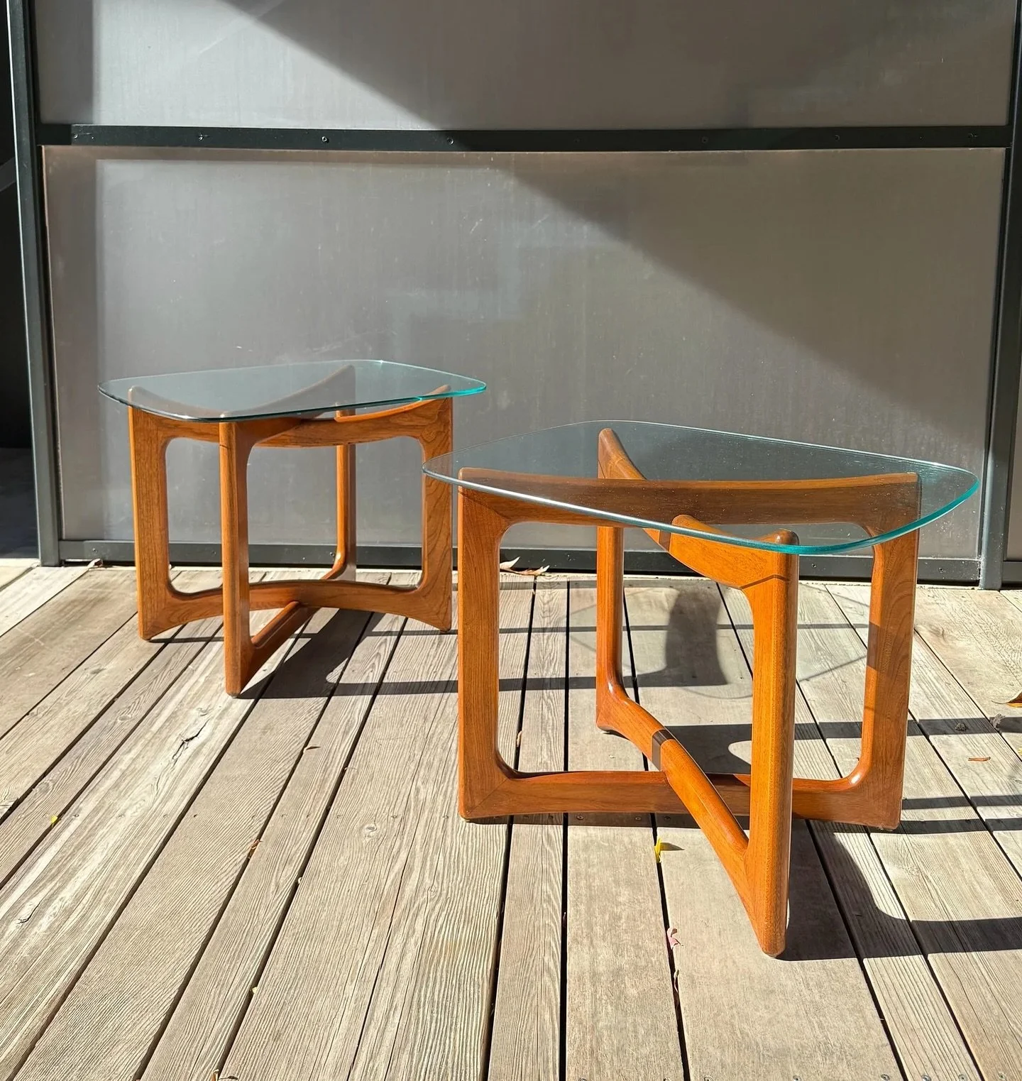 Available ~ Mid-Century sculptural side tables in the manner of  Adrian Pearsall, circa 1960s

Unique geometric forms in classic Pearsall style. The base is constructed of sculpted walnut wood. Two wooden square shapes interlocking in the middle to f