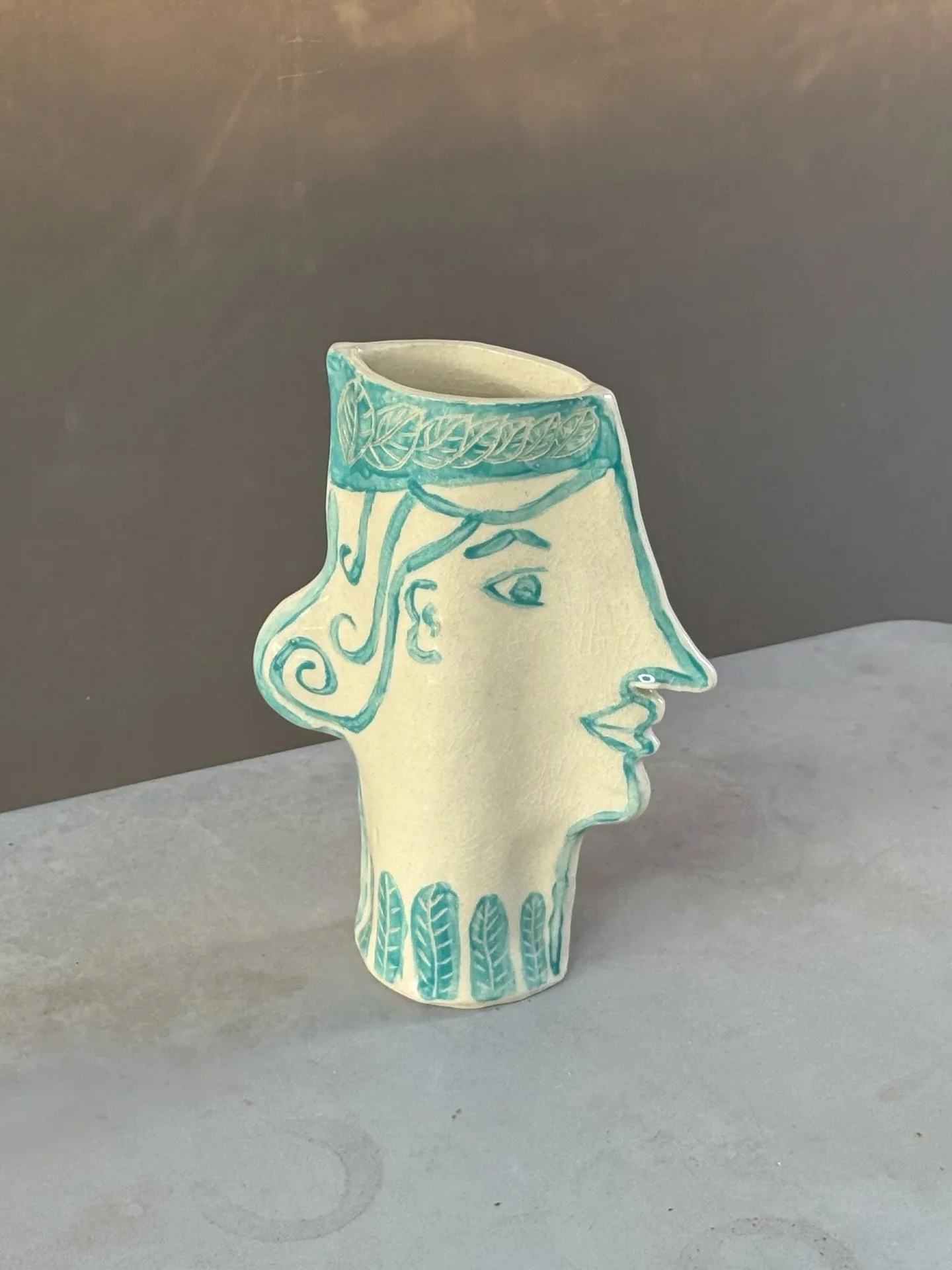 Face vases by @dotsandlinespottery.cary.nc available online and in store 

A mix of the old world and new age technique. Highly sculpted styled design made from stoneware, underglaze painted on leather hard clay and clear glaze high fired to cone six