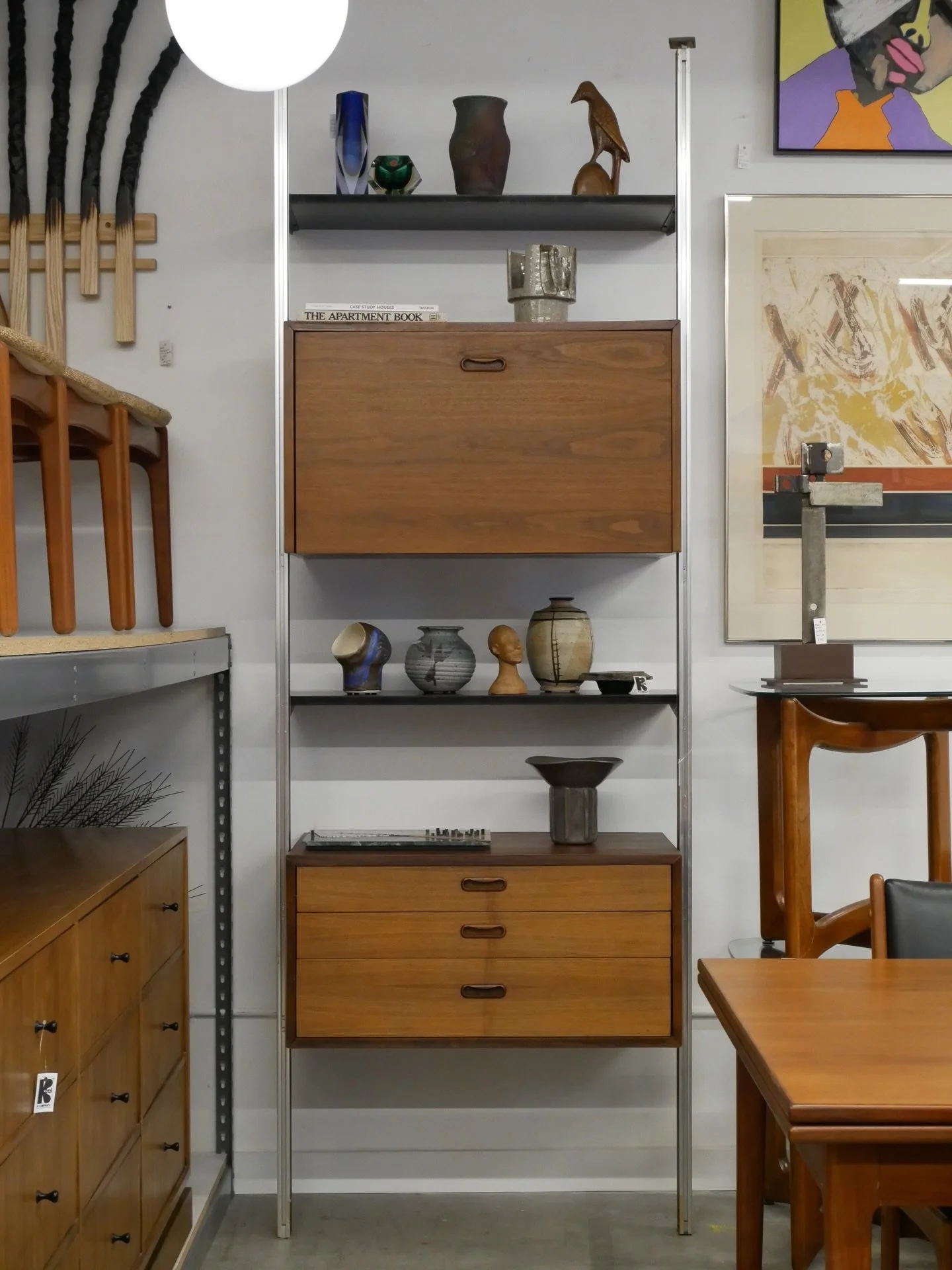 AVAILABLE ~ Mid-century tension single bay wall unit. The &lsquo;Omni System&rsquo; unit was designed by George Nelson, circa 1960s. 

Featuring two cases and two shelves. The top case features a drop-down door with great internal storage. The bottom