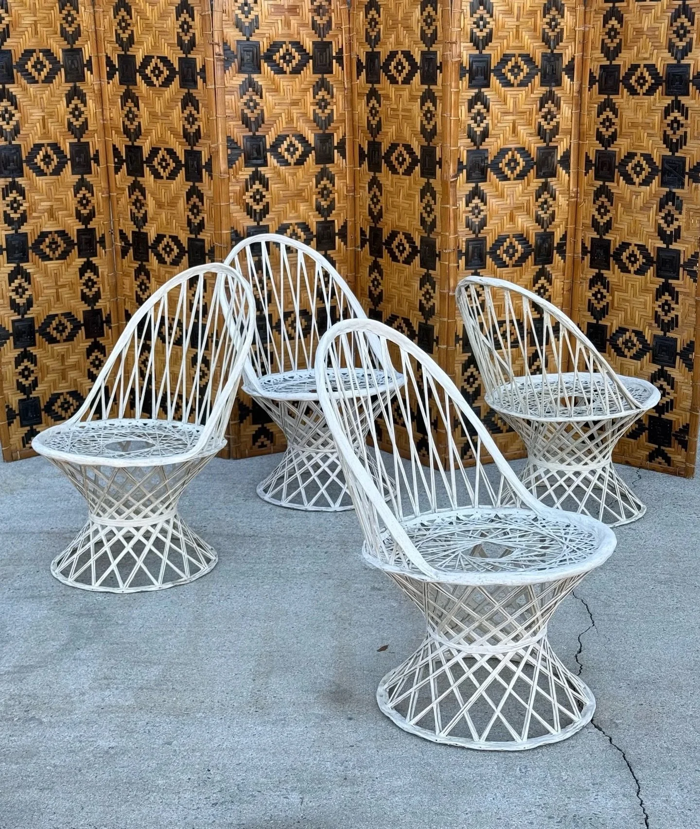 AVAILABLE ~ Set of four mid-century fiberglass chairs by Russell Woodard. 

This set of four is made from spun fiberglass which makes it a durable option for both indoor and outdoor use. Off-white neutral coloration with fantastic geometric lines. Th