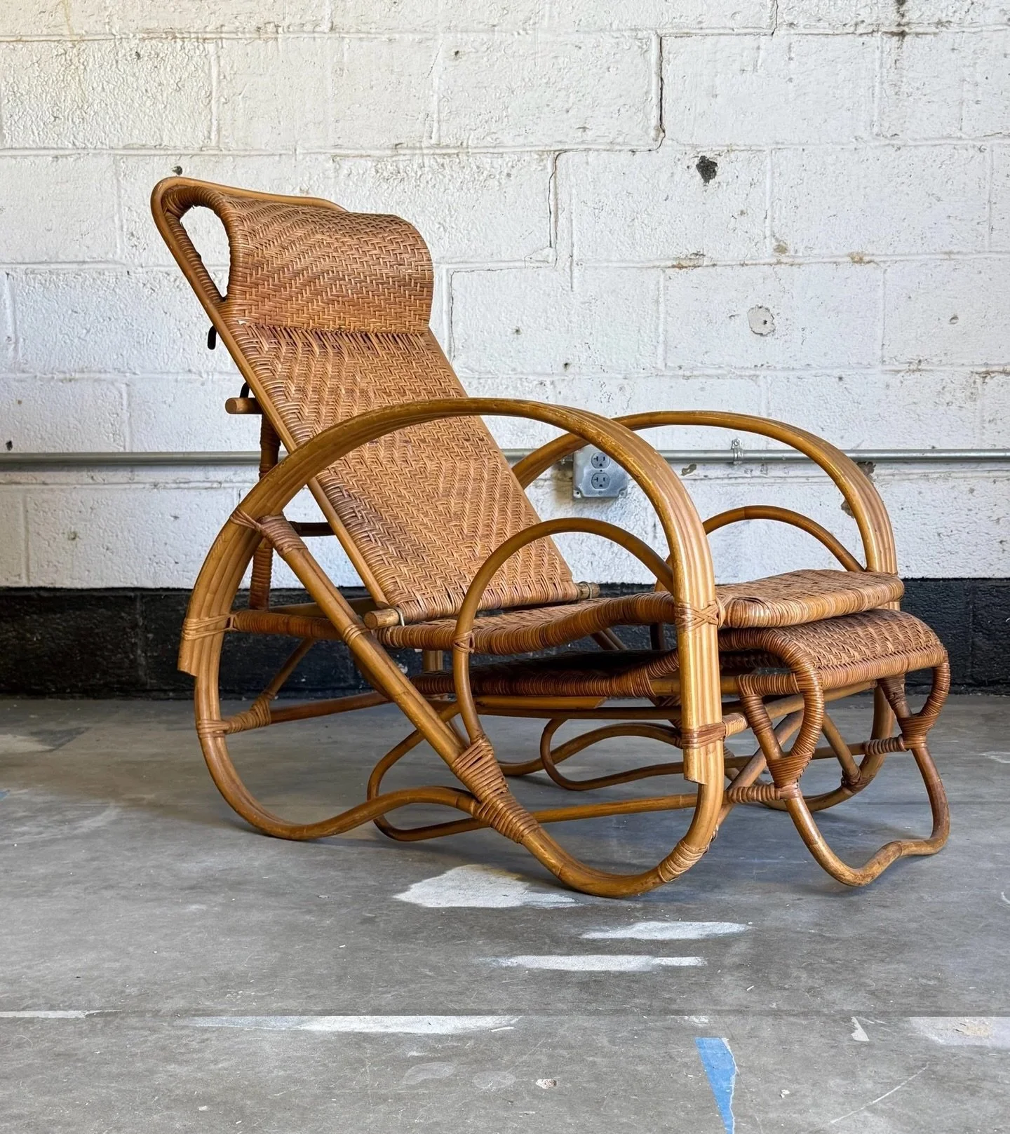 AVAILABLE ~ Vintage bentwood bamboo and rattan reclining chaise lounge. 

Boho or Italian Riviera style with really cool lines. Featuring an adjustable backrest with a sliding footrest which creates a comfortable seated position. The frame is made fr