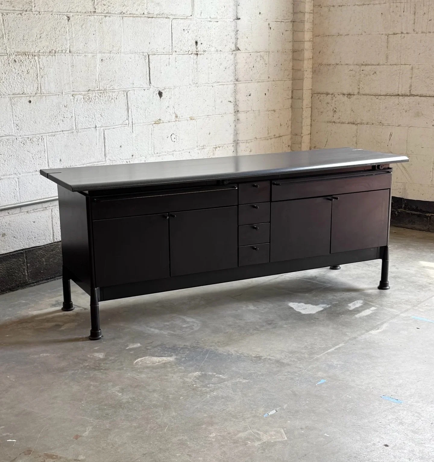 AVAILABLE ~ Vintage &lsquo;Relay&rsquo; credenza designed by Geoff Hollington for Herman Miller. This piece is extremely unique and can serve versatile functions.

The top has a large surface area with speckles. There is a slit in the top for lamp co