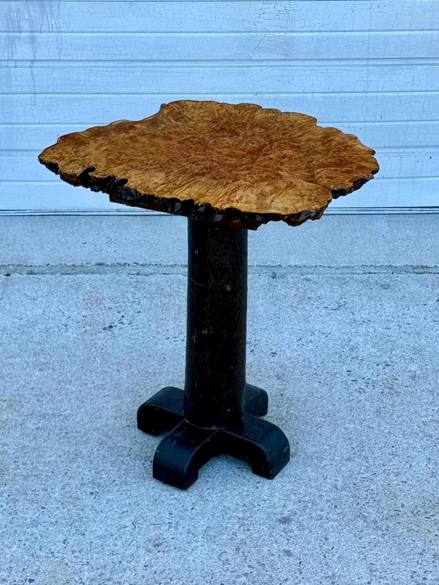 AVAILABLE ~ Vintage live-edge side table. 

Quite tall with a natural shape burl wood table top. The burl top sits atop a wooden pedestal base. A great addition for those looking in the naturalist or folk art style. Perfect for a foyer or corner. In 