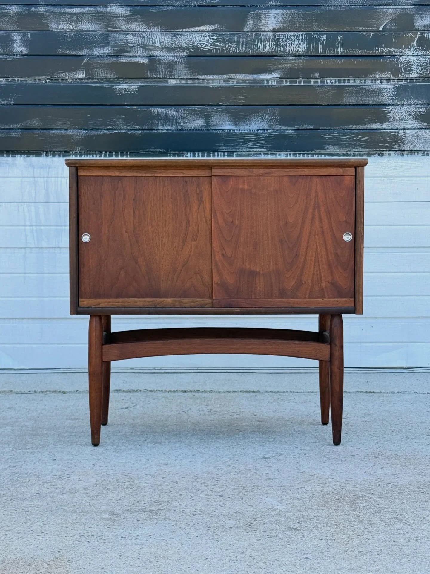 SOLD ~ Mid-century record cabinet or credenza. Compact design with great storage potential. Made from walnut wood.

This case features two smooth sliding doors that open to great internal storage. Each door has the original inset metal door pulls. Si