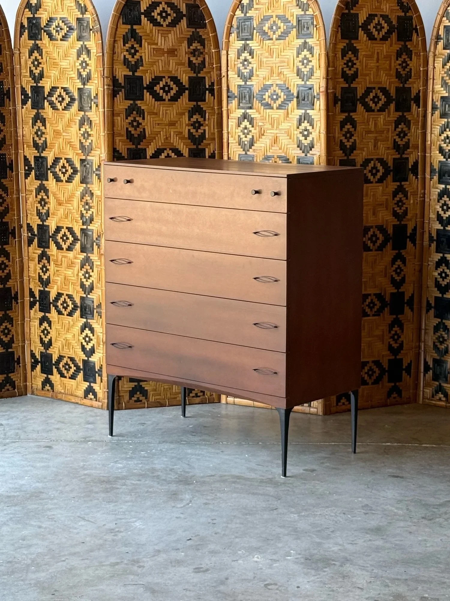 AVAILABLE ~ Mid-century tall boy dresser designed by Heywood Wakefield, circa 1960s. This piece is a part of Wakefield&rsquo;s &lsquo;Contessa&rsquo; furniture line. Made from walnut wood in a dark finish. 

Featuring five large drawers with ample st