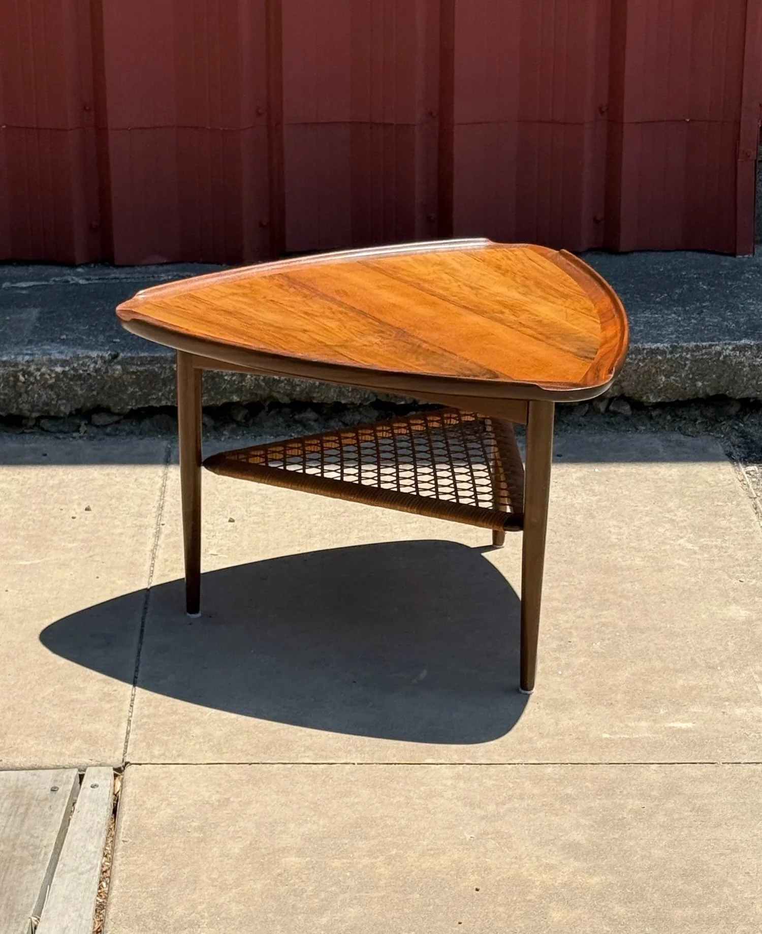 AVAILABLE ~ Mid-century &lsquo;guitar pick&rsquo; single side table. Designed by Poul Jensen for Selig. Made in Denmark, circa 1960s. The tabletop is made from teak wood in a rich warm tone.

The shape of the tabletop is in the shape of a guitar pick