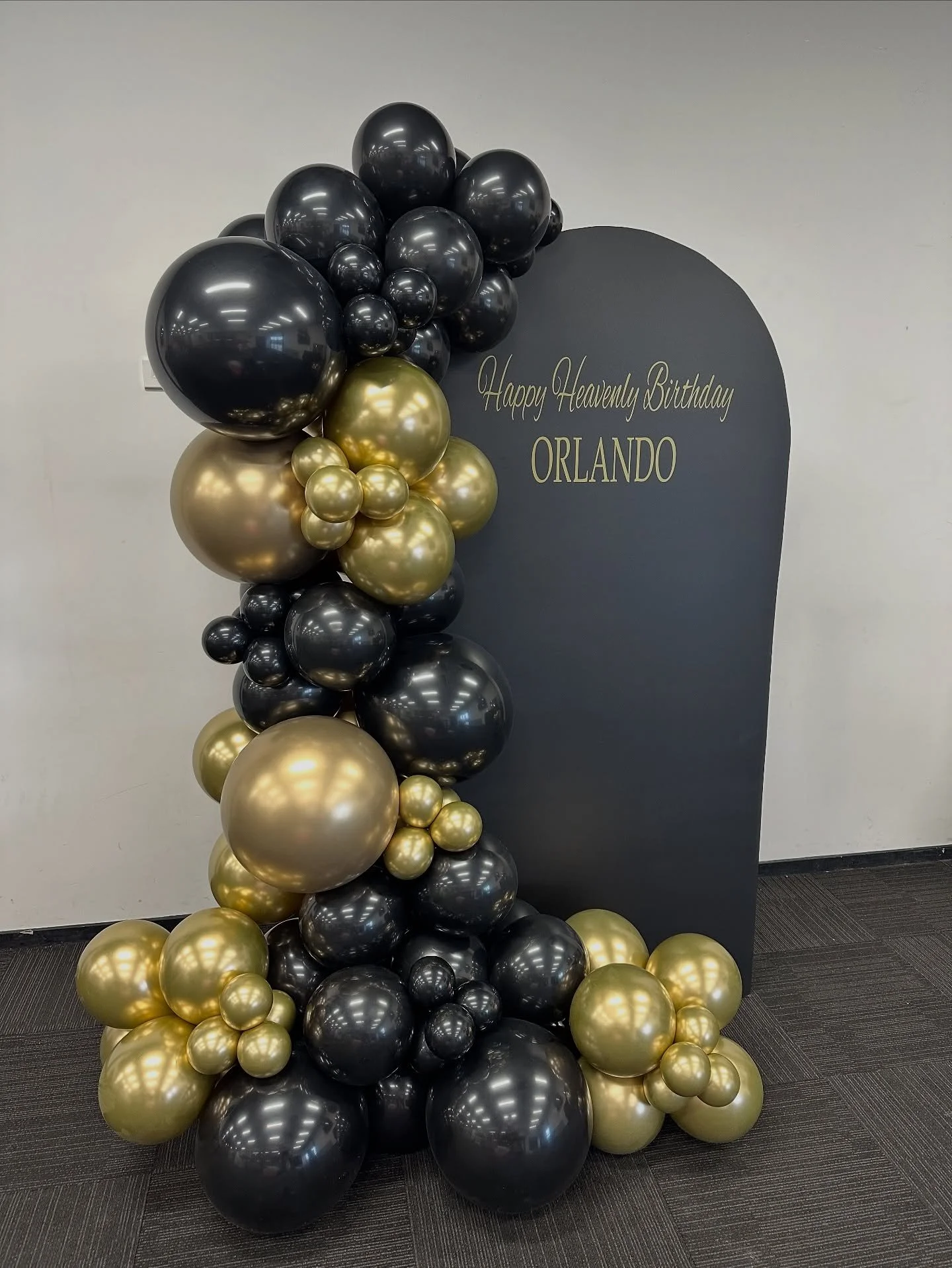 Happy Heavenly Birthday
A beautiful reminder to treasure those memories and celebrate them always 🤍

This setup featured a sleek black backdrop with a custom decal and a timeless black and gold balloon display &mdash; a classic yet striking way to h